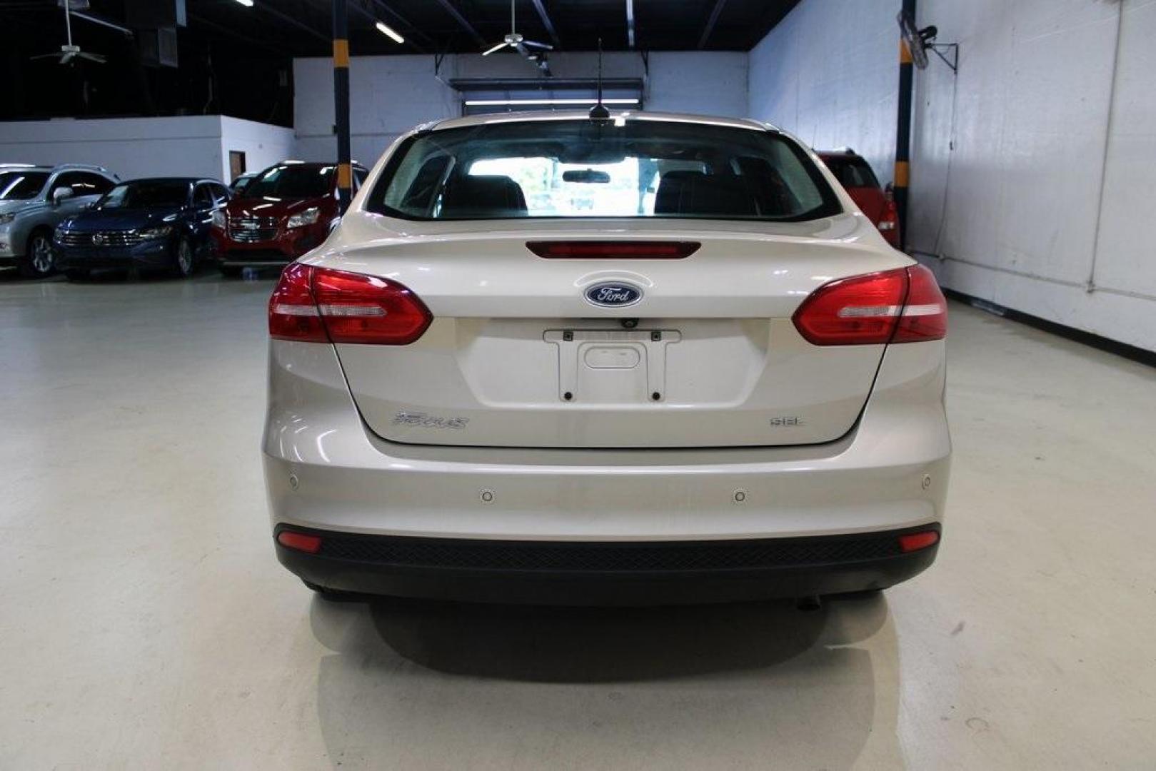2017 White Gold /Charcoal Black Ford Focus SEL (1FADP3H24HL) with an I4 engine, Automatic transmission, located at 15300 Midway Rd., Addison, TX, 75001, (972) 702-0011, 32.958321, -96.838074 - Photo#7