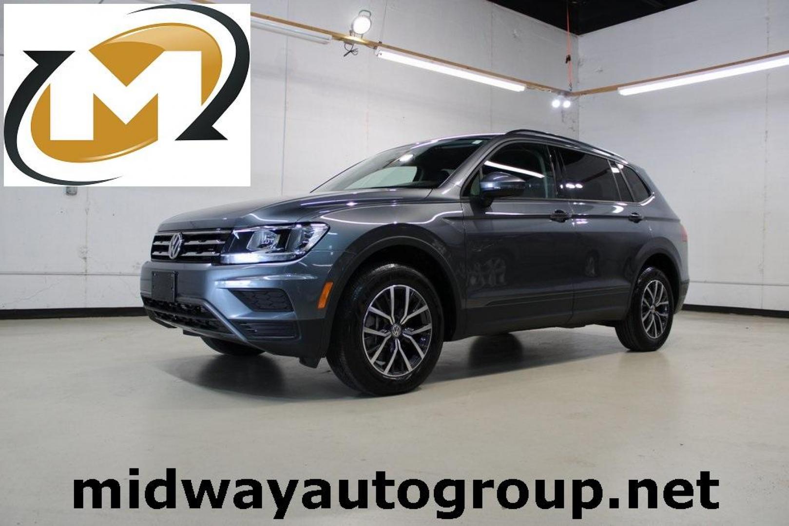 2021 Pyrite Silver Metallic /Storm Gray Volkswagen Tiguan 2.0T S (3VV1B7AX0MM) with an 2.0L TSI DOHC engine, Automatic transmission, located at 15300 Midway Rd., Addison, TX, 75001, (972) 702-0011, 32.958321, -96.838074 - HOME OF THE NO HAGGLE PRICE - WHOLESALE PRICES TO THE PUBLIC!! Tiguan 2.0T S, 4D Sport Utility, 2.0L TSI DOHC, 8-Speed Automatic with Tiptronic, FWD, Storm Gray Cloth.<br><br>Pyrite Silver Metallic 2021 Volkswagen Tiguan 2.0T S<br><br>23/29 City/Highway MPG<br><br><br>At Midway Auto Group, we strive - Photo#0