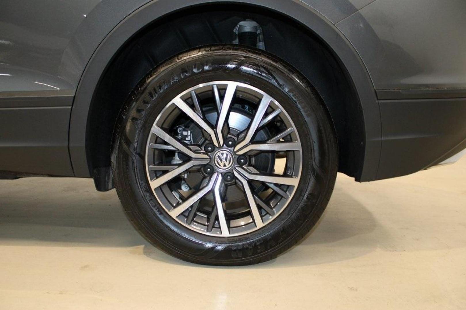 2021 Pyrite Silver Metallic /Storm Gray Volkswagen Tiguan 2.0T S (3VV1B7AX0MM) with an 2.0L TSI DOHC engine, Automatic transmission, located at 15300 Midway Rd., Addison, TX, 75001, (972) 702-0011, 32.958321, -96.838074 - HOME OF THE NO HAGGLE PRICE - WHOLESALE PRICES TO THE PUBLIC!! Tiguan 2.0T S, 4D Sport Utility, 2.0L TSI DOHC, 8-Speed Automatic with Tiptronic, FWD, Storm Gray Cloth.<br><br>Pyrite Silver Metallic 2021 Volkswagen Tiguan 2.0T S<br><br>23/29 City/Highway MPG<br><br><br>At Midway Auto Group, we strive - Photo#9