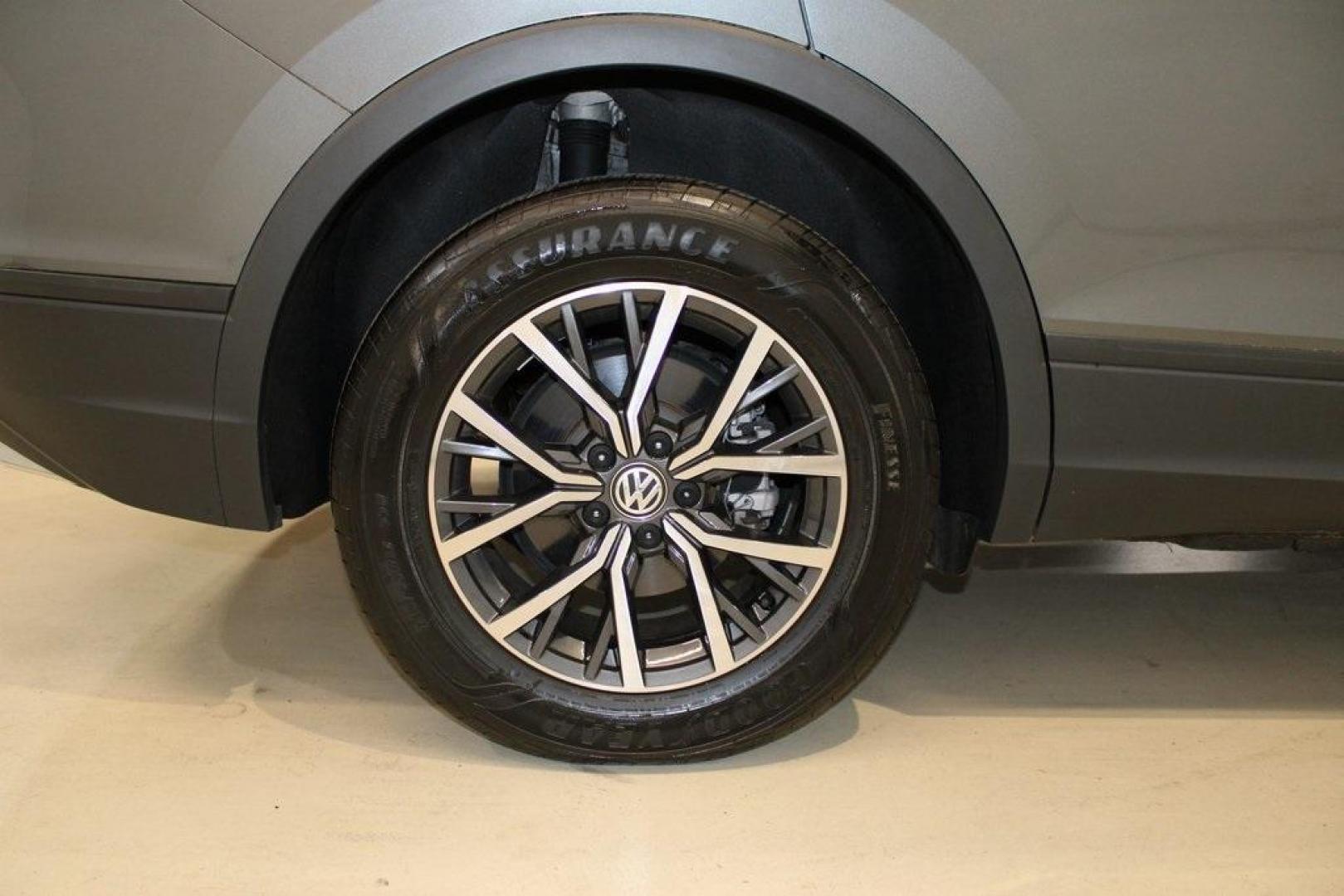 2021 Pyrite Silver Metallic /Storm Gray Volkswagen Tiguan 2.0T S (3VV1B7AX0MM) with an 2.0L TSI DOHC engine, Automatic transmission, located at 15300 Midway Rd., Addison, TX, 75001, (972) 702-0011, 32.958321, -96.838074 - HOME OF THE NO HAGGLE PRICE - WHOLESALE PRICES TO THE PUBLIC!! Tiguan 2.0T S, 4D Sport Utility, 2.0L TSI DOHC, 8-Speed Automatic with Tiptronic, FWD, Storm Gray Cloth.<br><br>Pyrite Silver Metallic 2021 Volkswagen Tiguan 2.0T S<br><br>23/29 City/Highway MPG<br><br><br>At Midway Auto Group, we strive - Photo#10