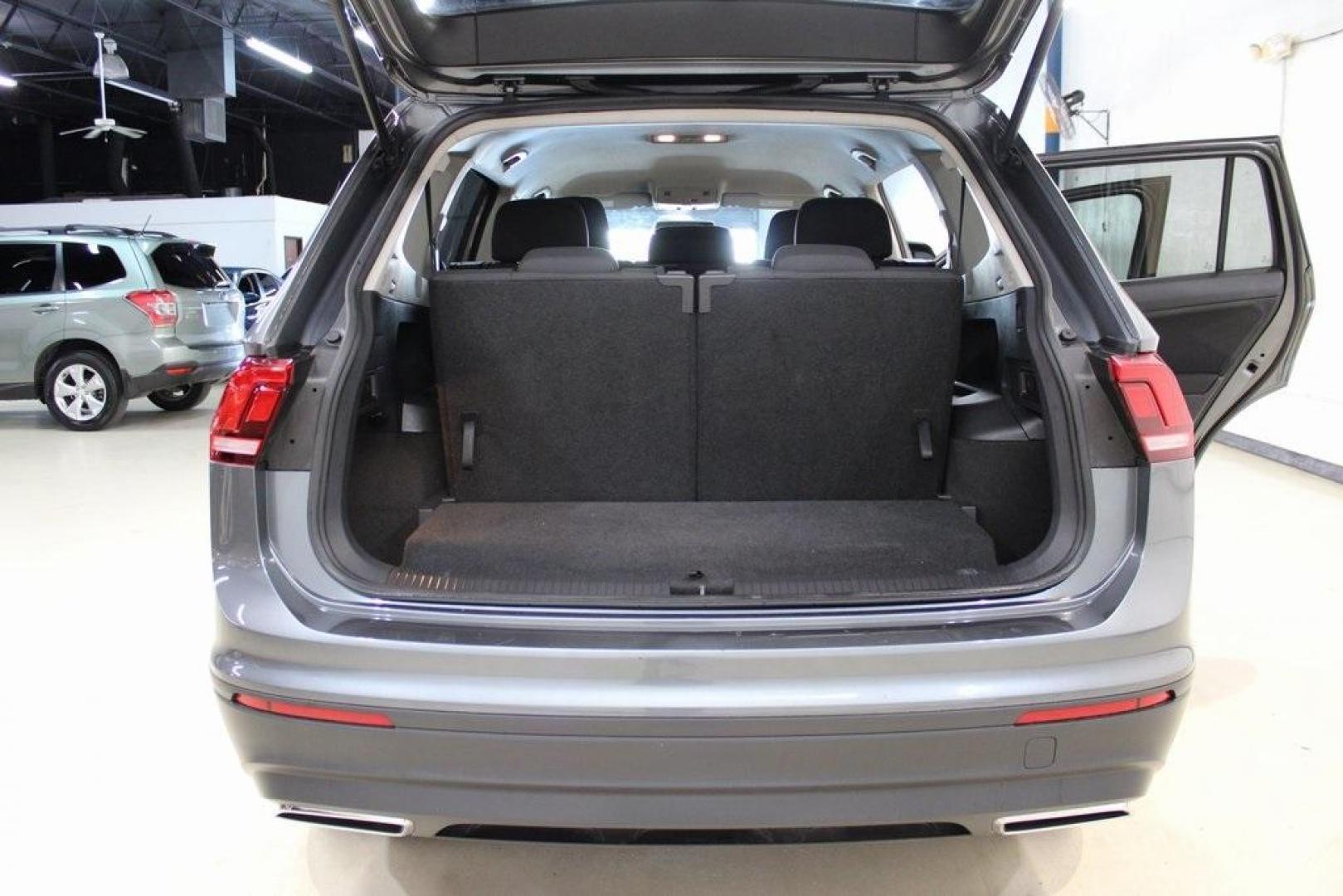 2021 Pyrite Silver Metallic /Storm Gray Volkswagen Tiguan 2.0T S (3VV1B7AX0MM) with an 2.0L TSI DOHC engine, Automatic transmission, located at 15300 Midway Rd., Addison, TX, 75001, (972) 702-0011, 32.958321, -96.838074 - HOME OF THE NO HAGGLE PRICE - WHOLESALE PRICES TO THE PUBLIC!! Tiguan 2.0T S, 4D Sport Utility, 2.0L TSI DOHC, 8-Speed Automatic with Tiptronic, FWD, Storm Gray Cloth.<br><br>Pyrite Silver Metallic 2021 Volkswagen Tiguan 2.0T S<br><br>23/29 City/Highway MPG<br><br><br>At Midway Auto Group, we strive - Photo#13