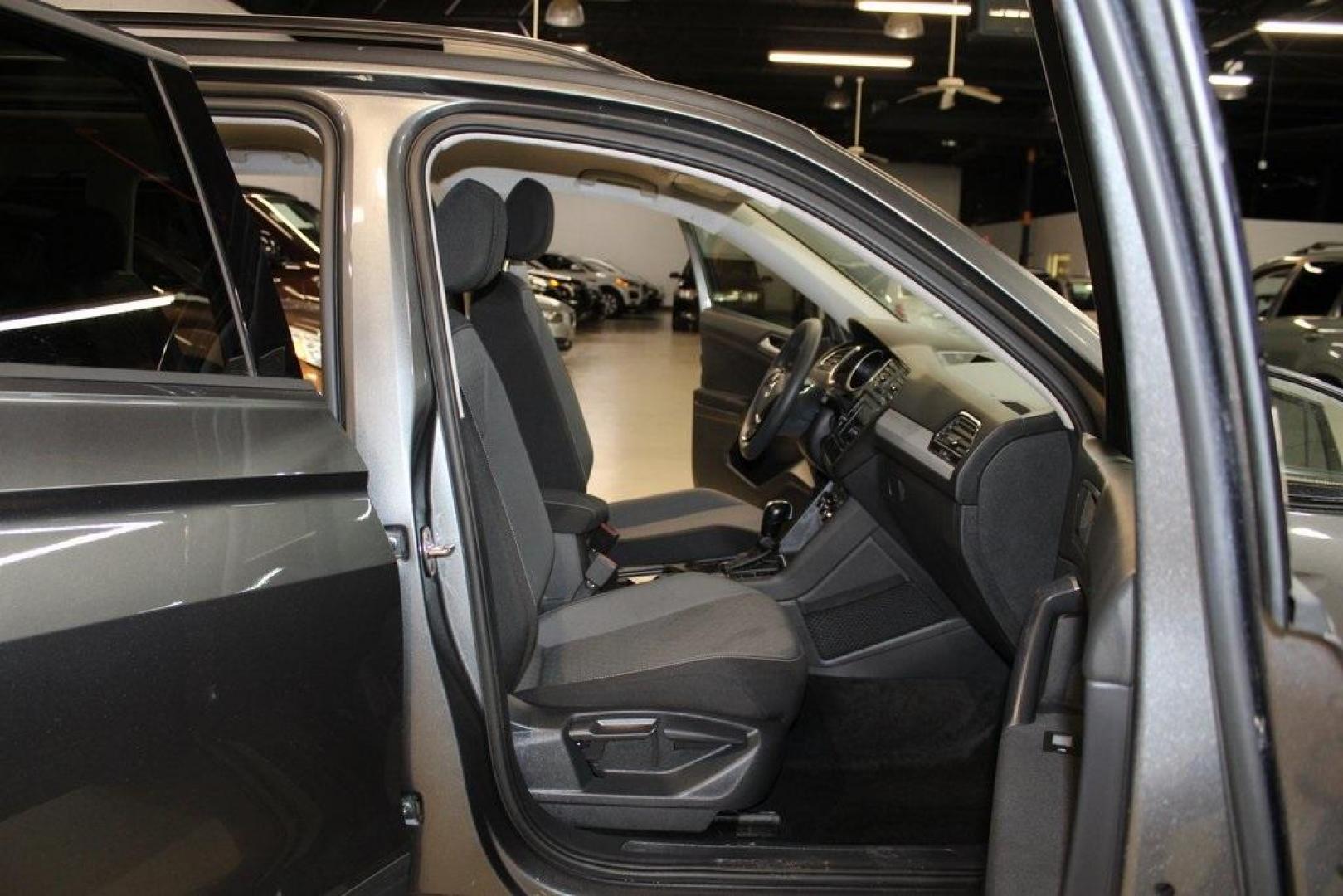 2021 Pyrite Silver Metallic /Storm Gray Volkswagen Tiguan 2.0T S (3VV1B7AX0MM) with an 2.0L TSI DOHC engine, Automatic transmission, located at 15300 Midway Rd., Addison, TX, 75001, (972) 702-0011, 32.958321, -96.838074 - HOME OF THE NO HAGGLE PRICE - WHOLESALE PRICES TO THE PUBLIC!! Tiguan 2.0T S, 4D Sport Utility, 2.0L TSI DOHC, 8-Speed Automatic with Tiptronic, FWD, Storm Gray Cloth.<br><br>Pyrite Silver Metallic 2021 Volkswagen Tiguan 2.0T S<br><br>23/29 City/Highway MPG<br><br><br>At Midway Auto Group, we strive - Photo#15