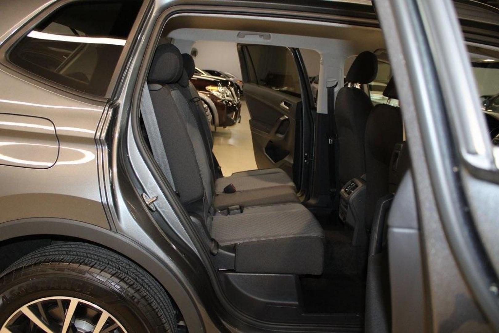 2021 Pyrite Silver Metallic /Storm Gray Volkswagen Tiguan 2.0T S (3VV1B7AX0MM) with an 2.0L TSI DOHC engine, Automatic transmission, located at 15300 Midway Rd., Addison, TX, 75001, (972) 702-0011, 32.958321, -96.838074 - HOME OF THE NO HAGGLE PRICE - WHOLESALE PRICES TO THE PUBLIC!! Tiguan 2.0T S, 4D Sport Utility, 2.0L TSI DOHC, 8-Speed Automatic with Tiptronic, FWD, Storm Gray Cloth.<br><br>Pyrite Silver Metallic 2021 Volkswagen Tiguan 2.0T S<br><br>23/29 City/Highway MPG<br><br><br>At Midway Auto Group, we strive - Photo#16