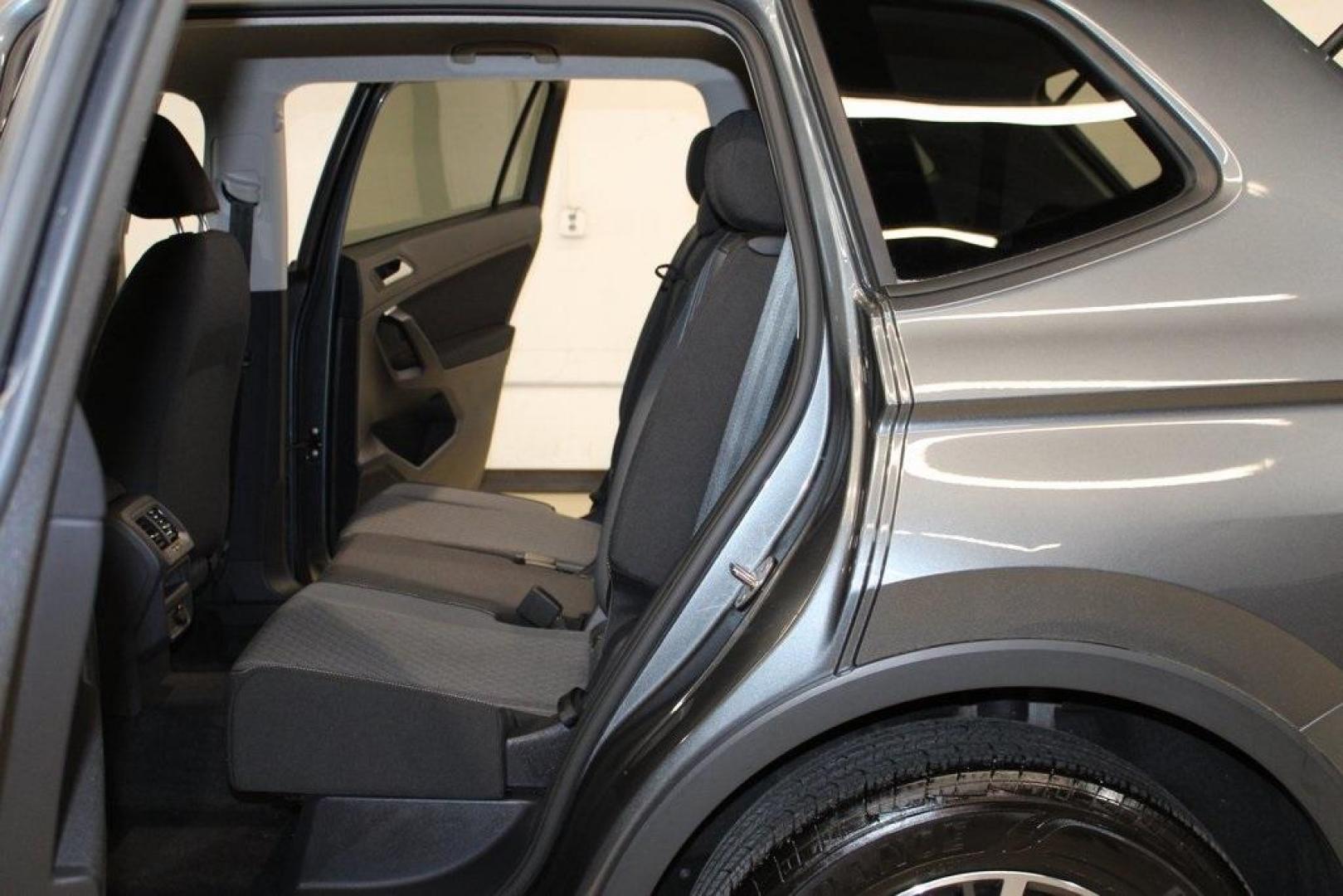 2021 Pyrite Silver Metallic /Storm Gray Volkswagen Tiguan 2.0T S (3VV1B7AX0MM) with an 2.0L TSI DOHC engine, Automatic transmission, located at 15300 Midway Rd., Addison, TX, 75001, (972) 702-0011, 32.958321, -96.838074 - HOME OF THE NO HAGGLE PRICE - WHOLESALE PRICES TO THE PUBLIC!! Tiguan 2.0T S, 4D Sport Utility, 2.0L TSI DOHC, 8-Speed Automatic with Tiptronic, FWD, Storm Gray Cloth.<br><br>Pyrite Silver Metallic 2021 Volkswagen Tiguan 2.0T S<br><br>23/29 City/Highway MPG<br><br><br>At Midway Auto Group, we strive - Photo#17