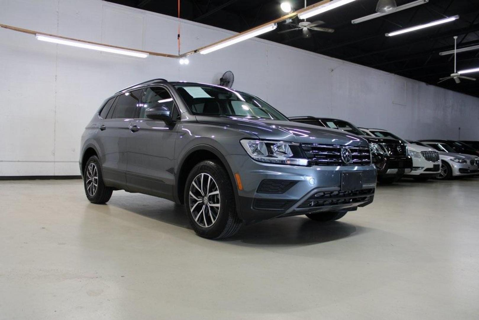 2021 Pyrite Silver Metallic /Storm Gray Volkswagen Tiguan 2.0T S (3VV1B7AX0MM) with an 2.0L TSI DOHC engine, Automatic transmission, located at 15300 Midway Rd., Addison, TX, 75001, (972) 702-0011, 32.958321, -96.838074 - HOME OF THE NO HAGGLE PRICE - WHOLESALE PRICES TO THE PUBLIC!! Tiguan 2.0T S, 4D Sport Utility, 2.0L TSI DOHC, 8-Speed Automatic with Tiptronic, FWD, Storm Gray Cloth.<br><br>Pyrite Silver Metallic 2021 Volkswagen Tiguan 2.0T S<br><br>23/29 City/Highway MPG<br><br><br>At Midway Auto Group, we strive - Photo#1