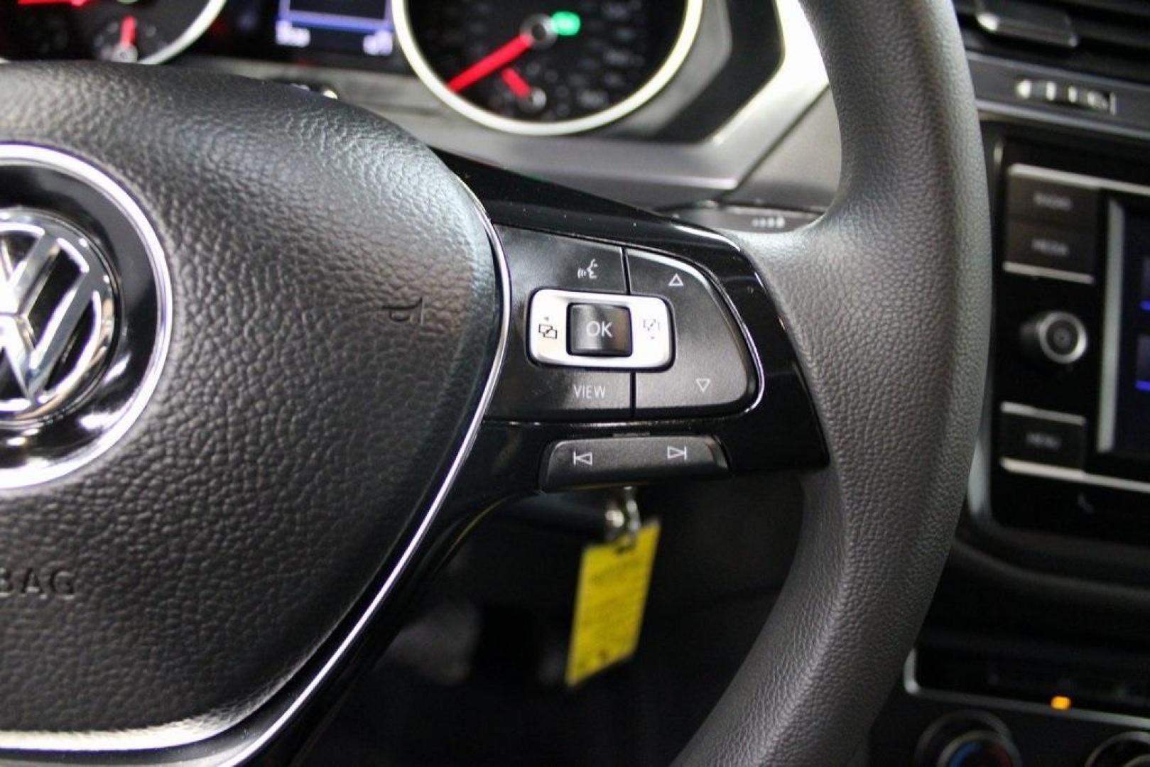2021 Pyrite Silver Metallic /Storm Gray Volkswagen Tiguan 2.0T S (3VV1B7AX0MM) with an 2.0L TSI DOHC engine, Automatic transmission, located at 15300 Midway Rd., Addison, TX, 75001, (972) 702-0011, 32.958321, -96.838074 - HOME OF THE NO HAGGLE PRICE - WHOLESALE PRICES TO THE PUBLIC!! Tiguan 2.0T S, 4D Sport Utility, 2.0L TSI DOHC, 8-Speed Automatic with Tiptronic, FWD, Storm Gray Cloth.<br><br>Pyrite Silver Metallic 2021 Volkswagen Tiguan 2.0T S<br><br>23/29 City/Highway MPG<br><br><br>At Midway Auto Group, we strive - Photo#25