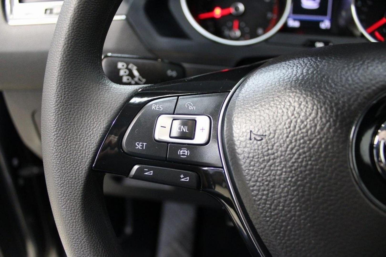 2021 Pyrite Silver Metallic /Storm Gray Volkswagen Tiguan 2.0T S (3VV1B7AX0MM) with an 2.0L TSI DOHC engine, Automatic transmission, located at 15300 Midway Rd., Addison, TX, 75001, (972) 702-0011, 32.958321, -96.838074 - HOME OF THE NO HAGGLE PRICE - WHOLESALE PRICES TO THE PUBLIC!! Tiguan 2.0T S, 4D Sport Utility, 2.0L TSI DOHC, 8-Speed Automatic with Tiptronic, FWD, Storm Gray Cloth.<br><br>Pyrite Silver Metallic 2021 Volkswagen Tiguan 2.0T S<br><br>23/29 City/Highway MPG<br><br><br>At Midway Auto Group, we strive - Photo#26