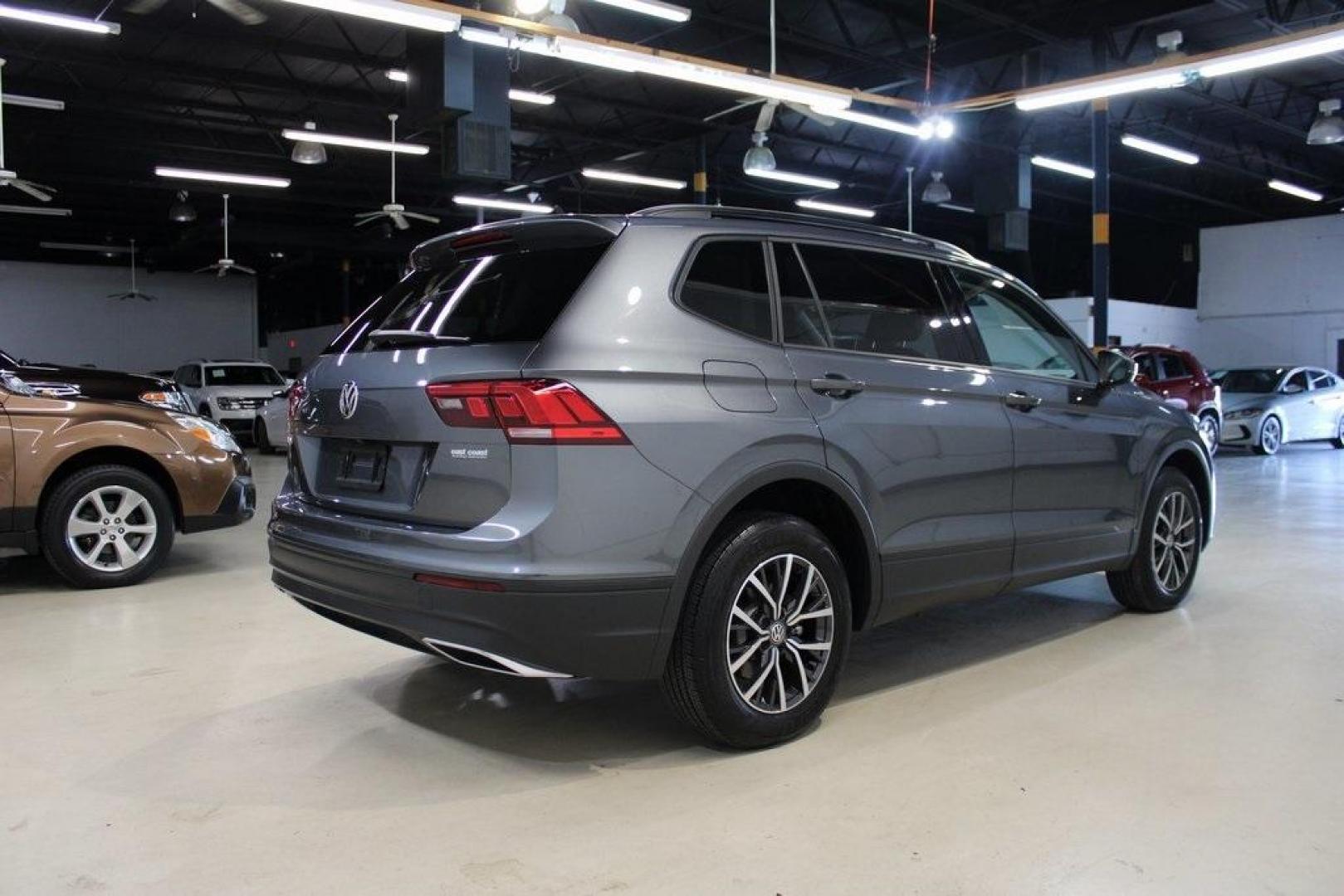 2021 Pyrite Silver Metallic /Storm Gray Volkswagen Tiguan 2.0T S (3VV1B7AX0MM) with an 2.0L TSI DOHC engine, Automatic transmission, located at 15300 Midway Rd., Addison, TX, 75001, (972) 702-0011, 32.958321, -96.838074 - HOME OF THE NO HAGGLE PRICE - WHOLESALE PRICES TO THE PUBLIC!! Tiguan 2.0T S, 4D Sport Utility, 2.0L TSI DOHC, 8-Speed Automatic with Tiptronic, FWD, Storm Gray Cloth.<br><br>Pyrite Silver Metallic 2021 Volkswagen Tiguan 2.0T S<br><br>23/29 City/Highway MPG<br><br><br>At Midway Auto Group, we strive - Photo#2