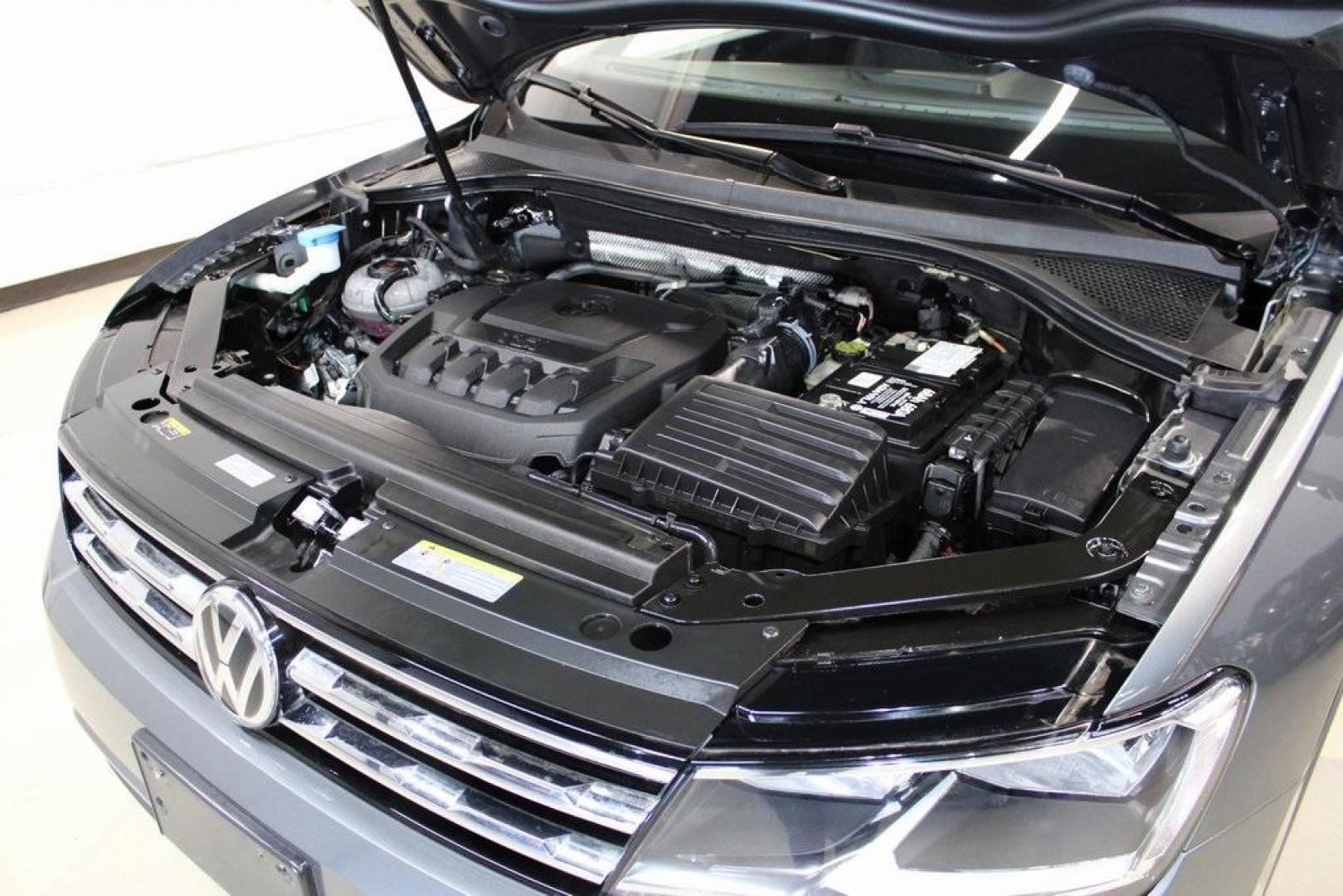 2021 Pyrite Silver Metallic /Storm Gray Volkswagen Tiguan 2.0T S (3VV1B7AX0MM) with an 2.0L TSI DOHC engine, Automatic transmission, located at 15300 Midway Rd., Addison, TX, 75001, (972) 702-0011, 32.958321, -96.838074 - HOME OF THE NO HAGGLE PRICE - WHOLESALE PRICES TO THE PUBLIC!! Tiguan 2.0T S, 4D Sport Utility, 2.0L TSI DOHC, 8-Speed Automatic with Tiptronic, FWD, Storm Gray Cloth.<br><br>Pyrite Silver Metallic 2021 Volkswagen Tiguan 2.0T S<br><br>23/29 City/Highway MPG<br><br><br>At Midway Auto Group, we strive - Photo#30