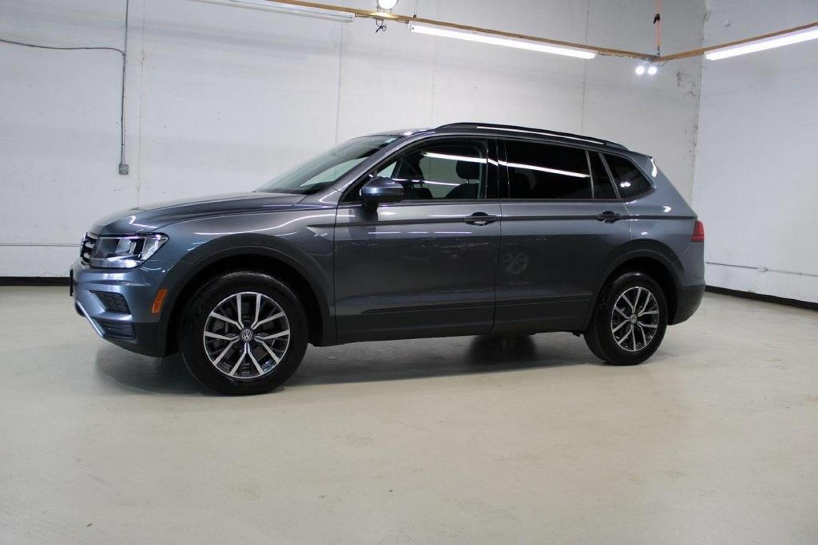 2021 Pyrite Silver Metallic /Storm Gray Volkswagen Tiguan 2.0T S (3VV1B7AX0MM) with an 2.0L TSI DOHC engine, Automatic transmission, located at 15300 Midway Rd., Addison, TX, 75001, (972) 702-0011, 32.958321, -96.838074 - HOME OF THE NO HAGGLE PRICE - WHOLESALE PRICES TO THE PUBLIC!! Tiguan 2.0T S, 4D Sport Utility, 2.0L TSI DOHC, 8-Speed Automatic with Tiptronic, FWD, Storm Gray Cloth.<br><br>Pyrite Silver Metallic 2021 Volkswagen Tiguan 2.0T S<br><br>23/29 City/Highway MPG<br><br><br>At Midway Auto Group, we strive - Photo#4