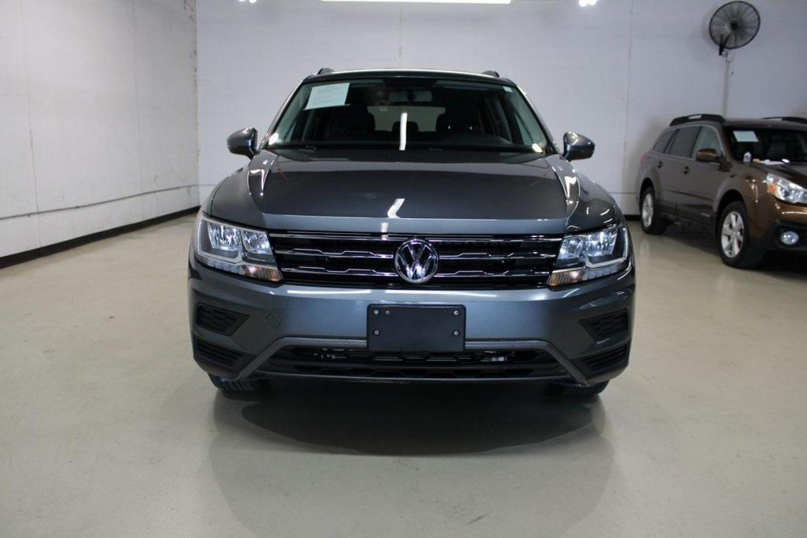 2021 Pyrite Silver Metallic /Storm Gray Volkswagen Tiguan 2.0T S (3VV1B7AX0MM) with an 2.0L TSI DOHC engine, Automatic transmission, located at 15300 Midway Rd., Addison, TX, 75001, (972) 702-0011, 32.958321, -96.838074 - HOME OF THE NO HAGGLE PRICE - WHOLESALE PRICES TO THE PUBLIC!! Tiguan 2.0T S, 4D Sport Utility, 2.0L TSI DOHC, 8-Speed Automatic with Tiptronic, FWD, Storm Gray Cloth.<br><br>Pyrite Silver Metallic 2021 Volkswagen Tiguan 2.0T S<br><br>23/29 City/Highway MPG<br><br><br>At Midway Auto Group, we strive - Photo#5