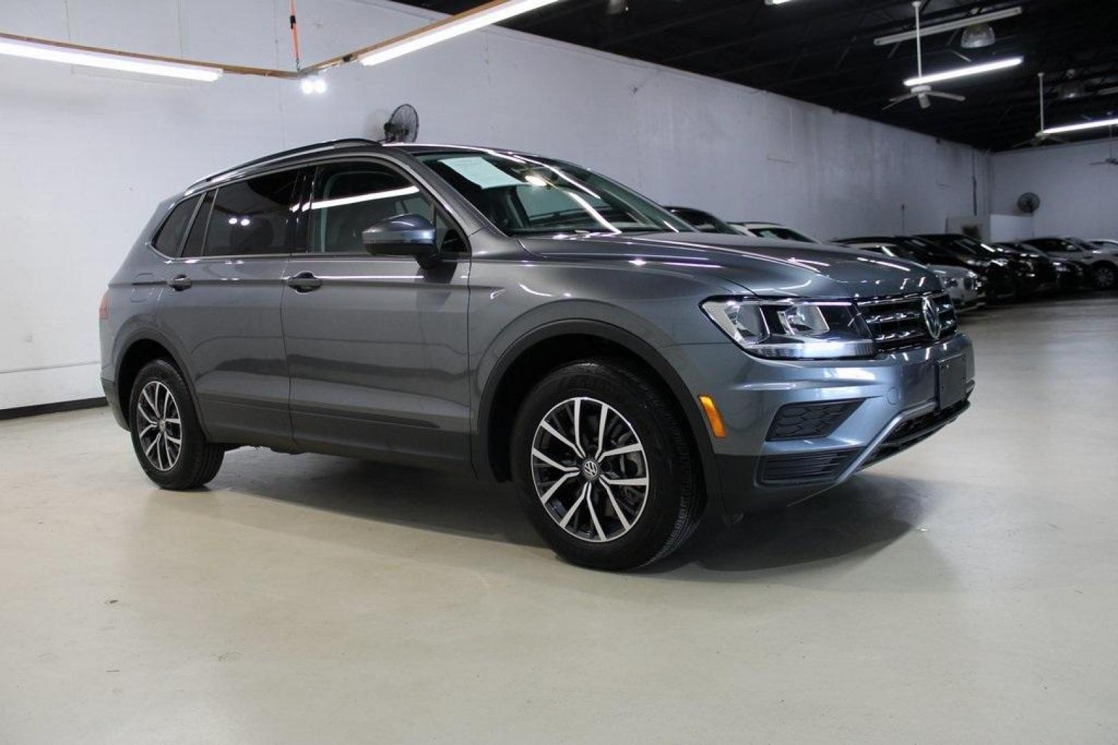 2021 Pyrite Silver Metallic /Storm Gray Volkswagen Tiguan 2.0T S (3VV1B7AX0MM) with an 2.0L TSI DOHC engine, Automatic transmission, located at 15300 Midway Rd., Addison, TX, 75001, (972) 702-0011, 32.958321, -96.838074 - HOME OF THE NO HAGGLE PRICE - WHOLESALE PRICES TO THE PUBLIC!! Tiguan 2.0T S, 4D Sport Utility, 2.0L TSI DOHC, 8-Speed Automatic with Tiptronic, FWD, Storm Gray Cloth.<br><br>Pyrite Silver Metallic 2021 Volkswagen Tiguan 2.0T S<br><br>23/29 City/Highway MPG<br><br><br>At Midway Auto Group, we strive - Photo#6