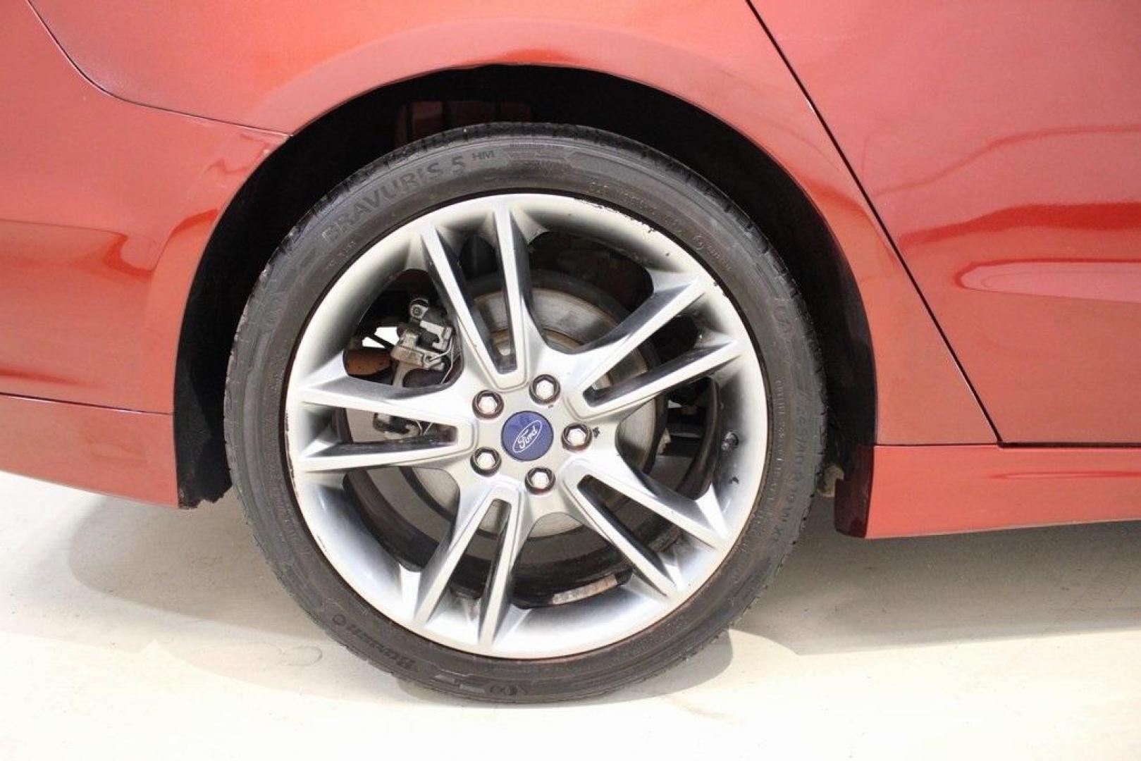2014 Sunset Metallic /Charcoal Black Ford Fusion Titanium (3FA6P0K97ER) with an EcoBoost 2.0L I4 GTDi DOHC Turbocharged VCT engine, Automatic transmission, located at 15300 Midway Rd., Addison, TX, 75001, (972) 702-0011, 32.958321, -96.838074 - HOME OF THE NO HAGGLE PRICE - WHOLESALE PRICES TO THE PUBLIC!! Fusion Titanium, 4D Sedan, EcoBoost 2.0L I4 GTDi DOHC Turbocharged VCT, 6-Speed Automatic, FWD, Orange, Leather.<br><br>Orange 2014 Ford Fusion Titanium<br><br>22/33 City/Highway MPG<br><br>Awards:<br> * 2014 IIHS Top Safety Pick+ * 2 - Photo#8