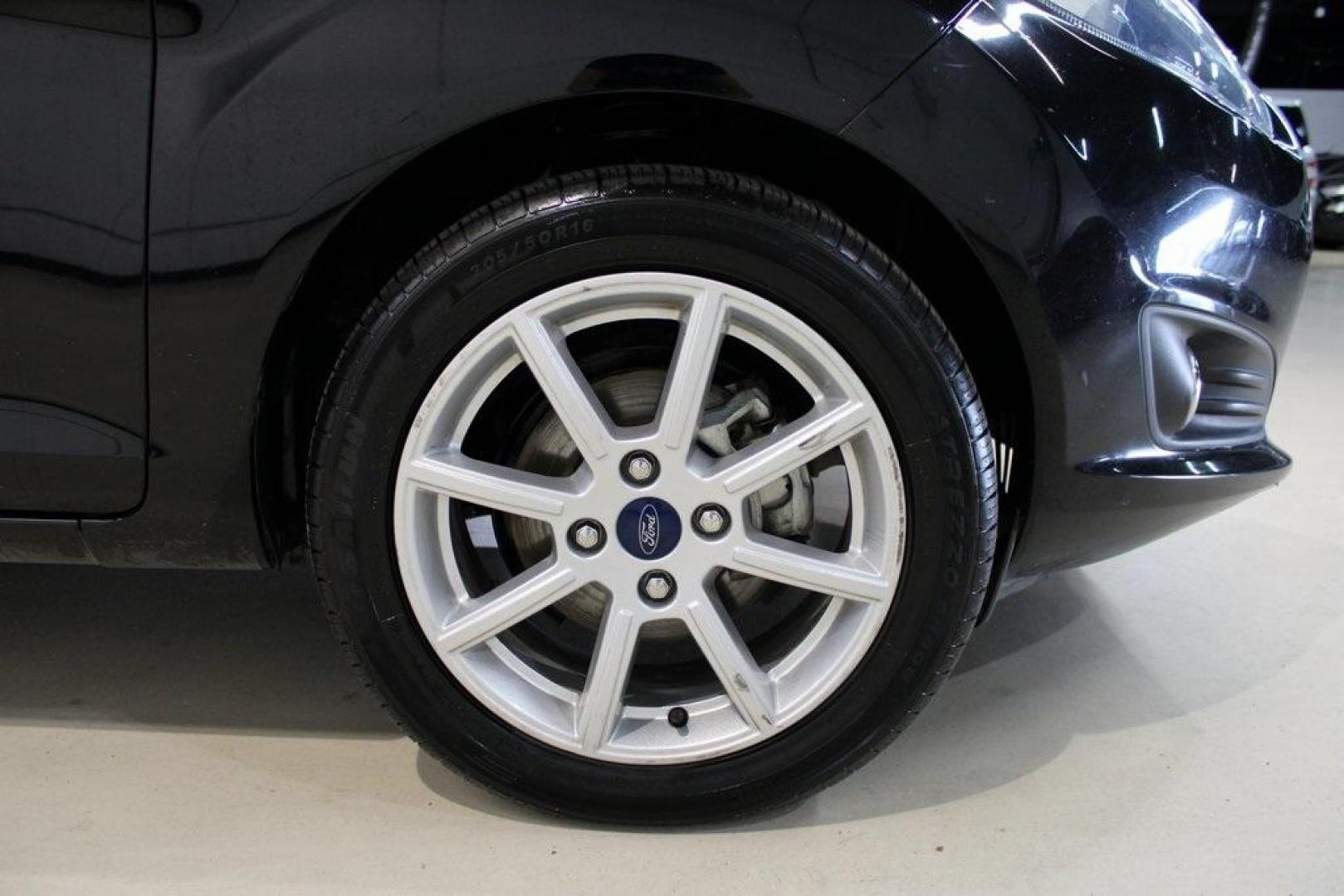 2019 Shadow Black /Charcoal Black Ford Fiesta SE (3FADP4BJ9KM) with an 1.6L I4 Ti-VCT engine, Automatic transmission, located at 15300 Midway Rd., Addison, TX, 75001, (972) 702-0011, 32.958321, -96.838074 - Introducing the 2019 Ford Fiesta SE, now available at Midway Auto Group in Addison, Texas. This compact sedan offers a harmonious blend of efficiency, comfort, and modern features, making it an excellent choice for daily commutes and city driving.<br><br>Key Features:<br><br>Engine: 1.6L I4 Ti-VCT<b - Photo#12