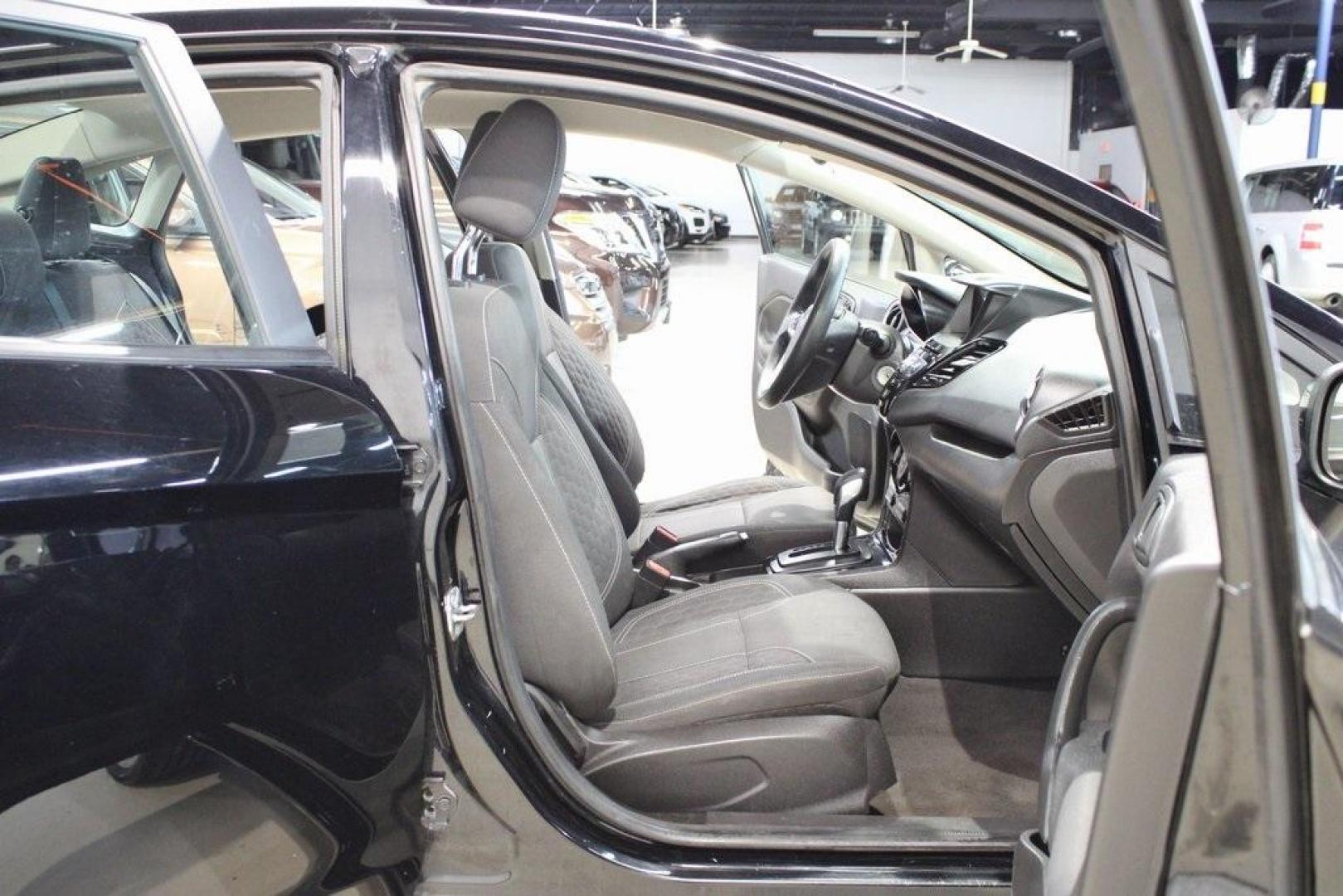 2019 Shadow Black /Charcoal Black Ford Fiesta SE (3FADP4BJ9KM) with an 1.6L I4 Ti-VCT engine, Automatic transmission, located at 15300 Midway Rd., Addison, TX, 75001, (972) 702-0011, 32.958321, -96.838074 - Introducing the 2019 Ford Fiesta SE, now available at Midway Auto Group in Addison, Texas. This compact sedan offers a harmonious blend of efficiency, comfort, and modern features, making it an excellent choice for daily commutes and city driving.<br><br>Key Features:<br><br>Engine: 1.6L I4 Ti-VCT<b - Photo#15