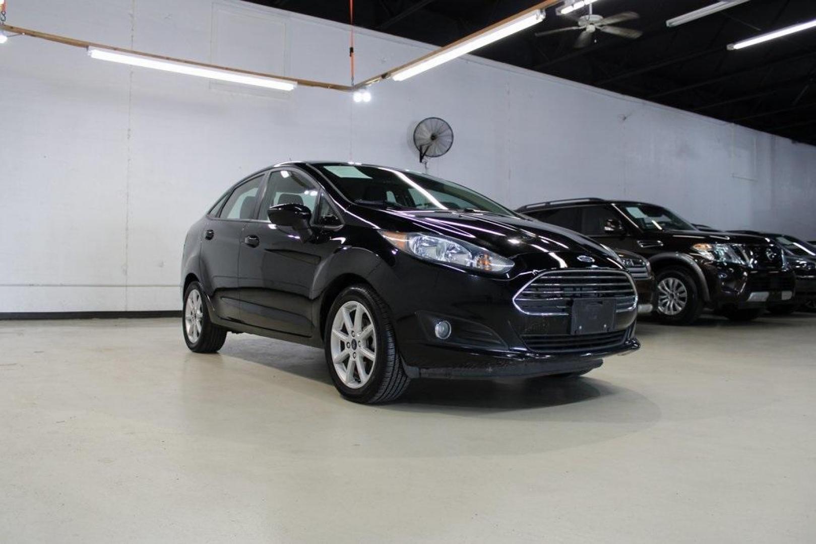 2019 Shadow Black /Charcoal Black Ford Fiesta SE (3FADP4BJ9KM) with an 1.6L I4 Ti-VCT engine, Automatic transmission, located at 15300 Midway Rd., Addison, TX, 75001, (972) 702-0011, 32.958321, -96.838074 - Introducing the 2019 Ford Fiesta SE, now available at Midway Auto Group in Addison, Texas. This compact sedan offers a harmonious blend of efficiency, comfort, and modern features, making it an excellent choice for daily commutes and city driving.<br><br>Key Features:<br><br>Engine: 1.6L I4 Ti-VCT<b - Photo#1
