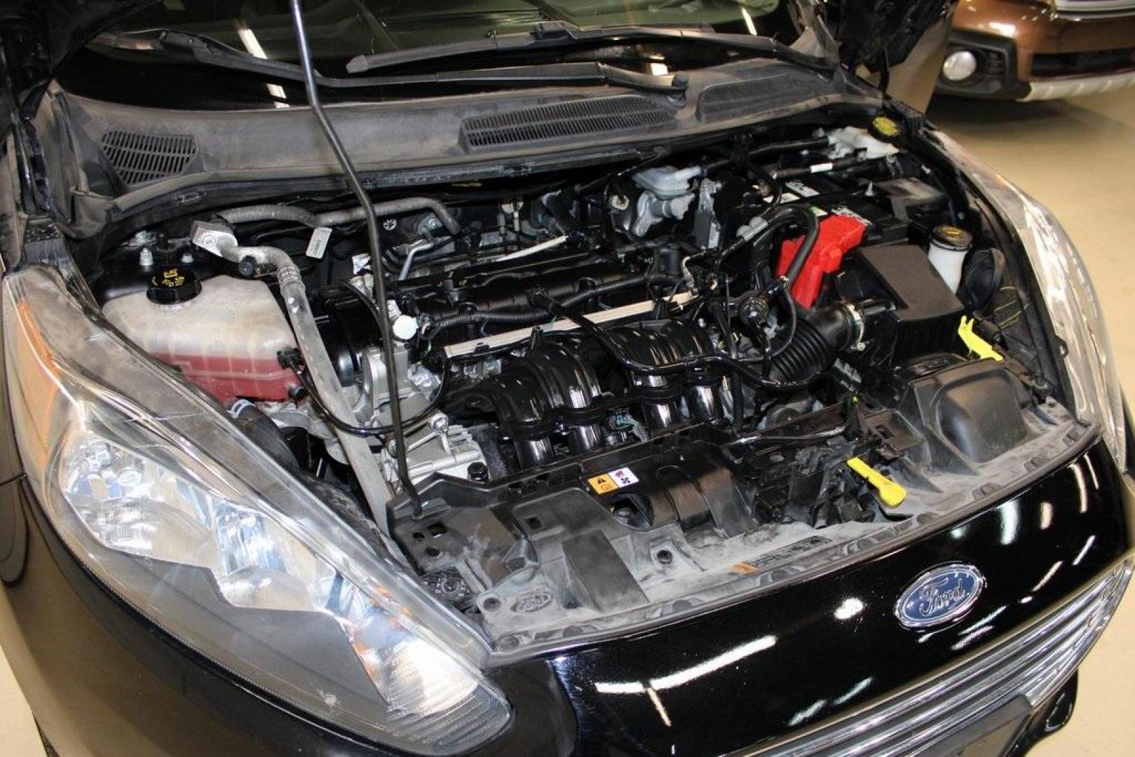 2019 Shadow Black /Charcoal Black Ford Fiesta SE (3FADP4BJ9KM) with an 1.6L I4 Ti-VCT engine, Automatic transmission, located at 15300 Midway Rd., Addison, TX, 75001, (972) 702-0011, 32.958321, -96.838074 - Introducing the 2019 Ford Fiesta SE, now available at Midway Auto Group in Addison, Texas. This compact sedan offers a harmonious blend of efficiency, comfort, and modern features, making it an excellent choice for daily commutes and city driving.<br><br>Key Features:<br><br>Engine: 1.6L I4 Ti-VCT<b - Photo#27