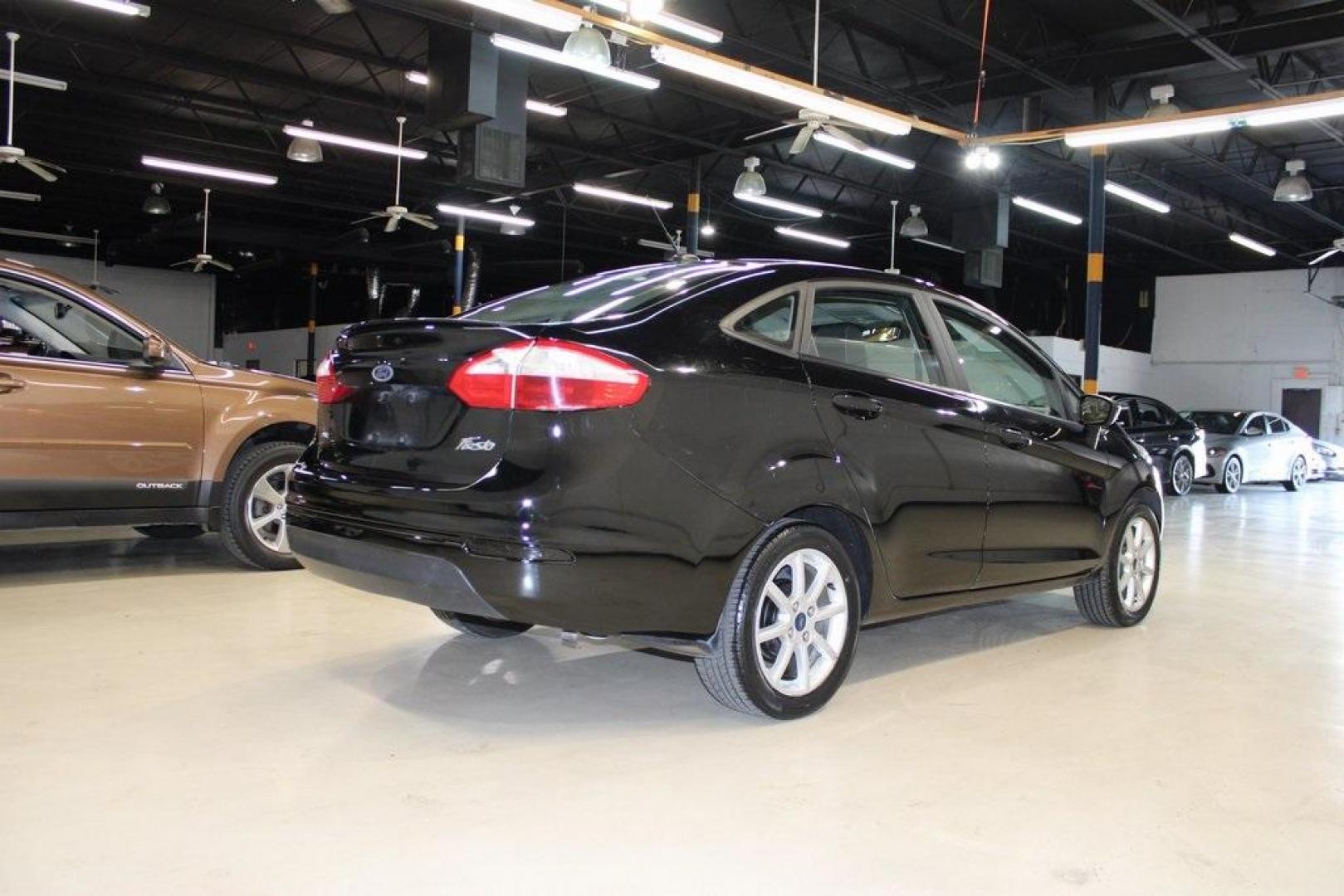 2019 Shadow Black /Charcoal Black Ford Fiesta SE (3FADP4BJ9KM) with an 1.6L I4 Ti-VCT engine, Automatic transmission, located at 15300 Midway Rd., Addison, TX, 75001, (972) 702-0011, 32.958321, -96.838074 - Introducing the 2019 Ford Fiesta SE, now available at Midway Auto Group in Addison, Texas. This compact sedan offers a harmonious blend of efficiency, comfort, and modern features, making it an excellent choice for daily commutes and city driving.<br><br>Key Features:<br><br>Engine: 1.6L I4 Ti-VCT<b - Photo#2