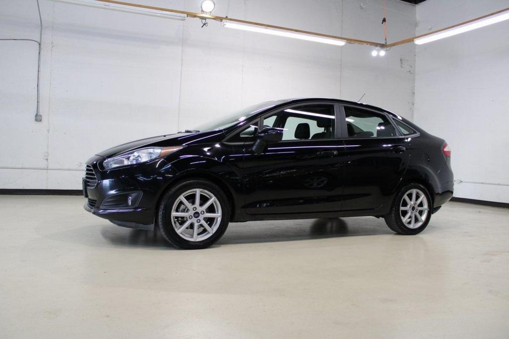 2019 Shadow Black /Charcoal Black Ford Fiesta SE (3FADP4BJ9KM) with an 1.6L I4 Ti-VCT engine, Automatic transmission, located at 15300 Midway Rd., Addison, TX, 75001, (972) 702-0011, 32.958321, -96.838074 - Introducing the 2019 Ford Fiesta SE, now available at Midway Auto Group in Addison, Texas. This compact sedan offers a harmonious blend of efficiency, comfort, and modern features, making it an excellent choice for daily commutes and city driving.<br><br>Key Features:<br><br>Engine: 1.6L I4 Ti-VCT<b - Photo#4