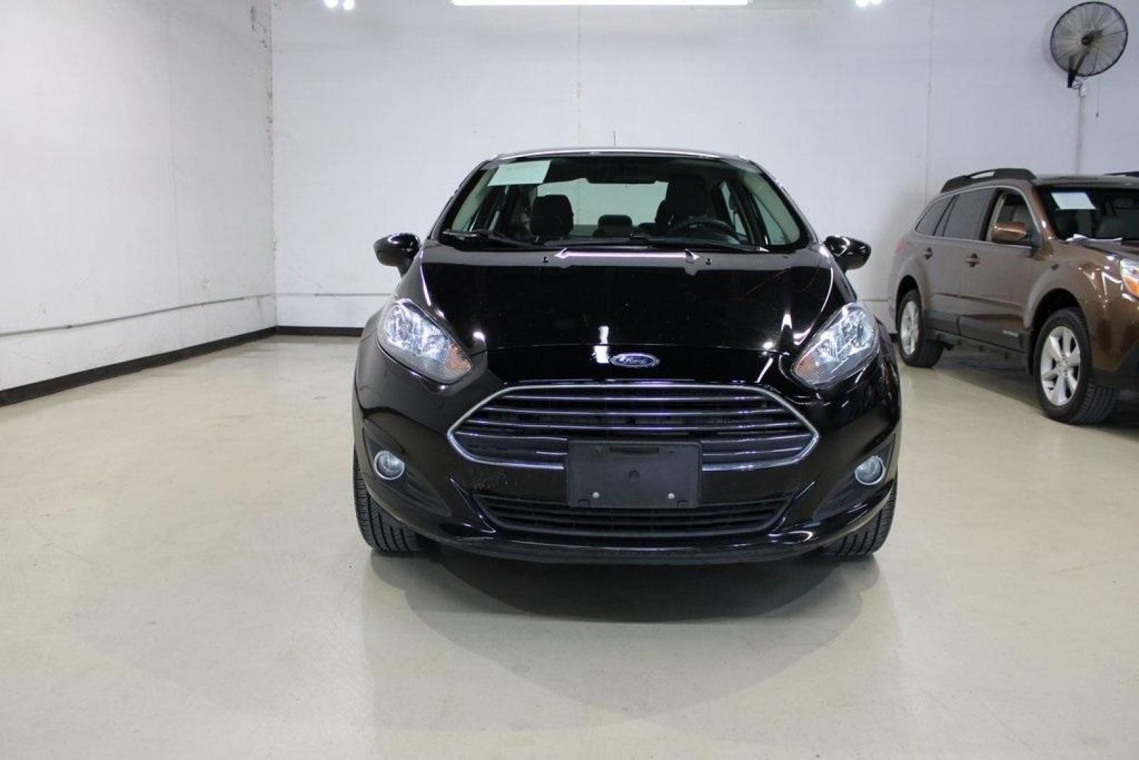 2019 Shadow Black /Charcoal Black Ford Fiesta SE (3FADP4BJ9KM) with an 1.6L I4 Ti-VCT engine, Automatic transmission, located at 15300 Midway Rd., Addison, TX, 75001, (972) 702-0011, 32.958321, -96.838074 - Introducing the 2019 Ford Fiesta SE, now available at Midway Auto Group in Addison, Texas. This compact sedan offers a harmonious blend of efficiency, comfort, and modern features, making it an excellent choice for daily commutes and city driving.<br><br>Key Features:<br><br>Engine: 1.6L I4 Ti-VCT<b - Photo#5