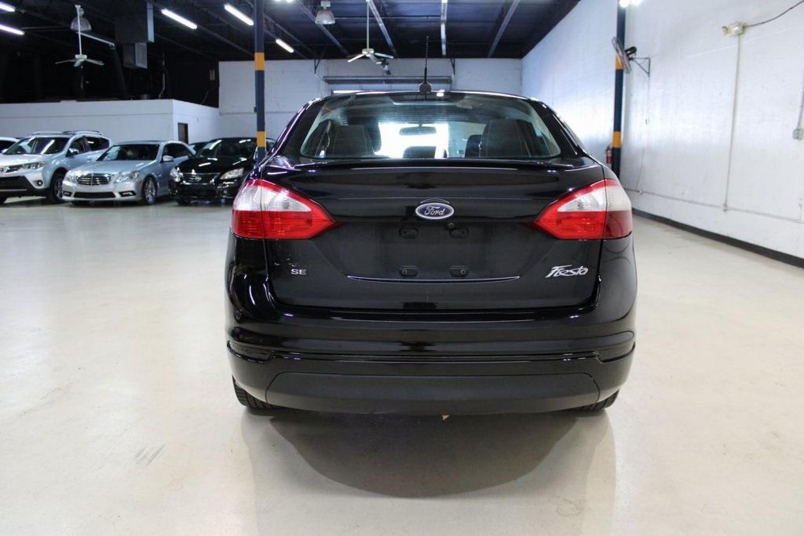 2019 Shadow Black /Charcoal Black Ford Fiesta SE (3FADP4BJ9KM) with an 1.6L I4 Ti-VCT engine, Automatic transmission, located at 15300 Midway Rd., Addison, TX, 75001, (972) 702-0011, 32.958321, -96.838074 - Introducing the 2019 Ford Fiesta SE, now available at Midway Auto Group in Addison, Texas. This compact sedan offers a harmonious blend of efficiency, comfort, and modern features, making it an excellent choice for daily commutes and city driving.<br><br>Key Features:<br><br>Engine: 1.6L I4 Ti-VCT<b - Photo#7