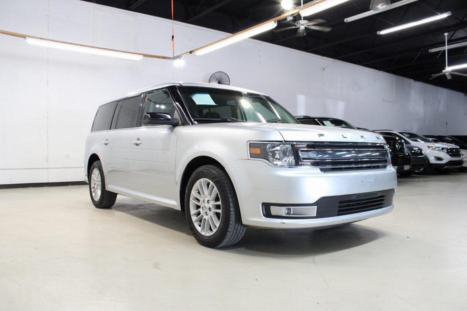 2013 Ingot Silver /Charcoal Black Ford Flex SEL (2FMGK5C83DB) with an 3.5L V6 Ti-VCT engine, Automatic transmission, located at 15300 Midway Rd., Addison, TX, 75001, (972) 702-0011, 32.958321, -96.838074 - HOME OF THE NO HAGGLE PRICE - WHOLESALE PRICES TO THE PUBLIC!! Flex SEL, 4D Sport Utility, 3.5L V6 Ti-VCT, 6-Speed Automatic with Select-Shift, FWD, Silver, Charcoal Black Cloth.<br><br>Silver 2013 Ford Flex SEL<br><br><br>Awards:<br> * 2013 IIHS Top Safety Pick * 2013 KBB.com Brand Image Awards< - Photo#1