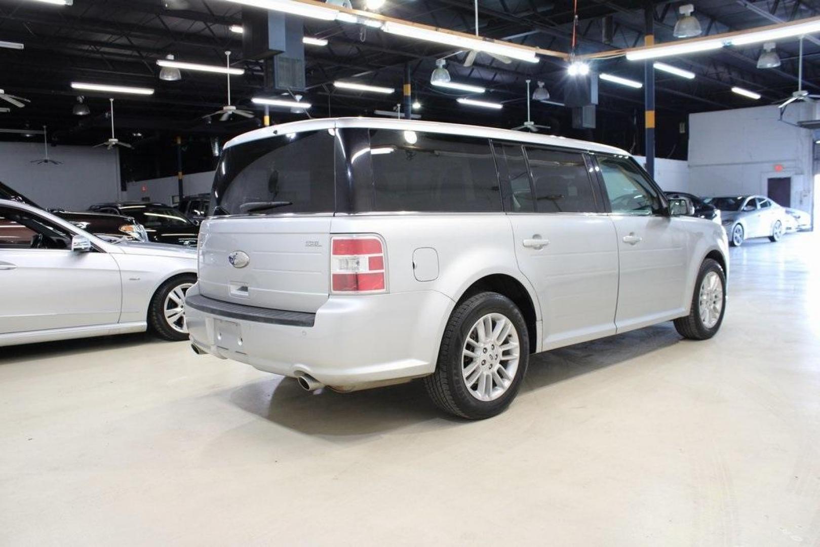 2013 Ingot Silver /Charcoal Black Ford Flex SEL (2FMGK5C83DB) with an 3.5L V6 Ti-VCT engine, Automatic transmission, located at 15300 Midway Rd., Addison, TX, 75001, (972) 702-0011, 32.958321, -96.838074 - HOME OF THE NO HAGGLE PRICE - WHOLESALE PRICES TO THE PUBLIC!! Flex SEL, 4D Sport Utility, 3.5L V6 Ti-VCT, 6-Speed Automatic with Select-Shift, FWD, Silver, Charcoal Black Cloth.<br><br>Silver 2013 Ford Flex SEL<br><br><br>Awards:<br> * 2013 IIHS Top Safety Pick * 2013 KBB.com Brand Image Awards< - Photo#2