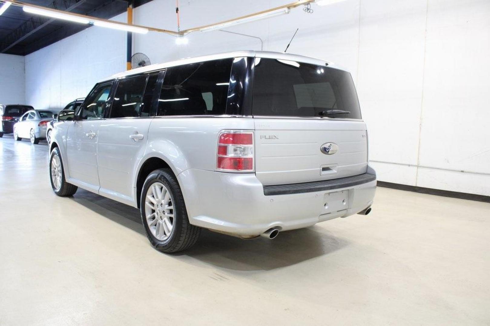 2013 Ingot Silver /Charcoal Black Ford Flex SEL (2FMGK5C83DB) with an 3.5L V6 Ti-VCT engine, Automatic transmission, located at 15300 Midway Rd., Addison, TX, 75001, (972) 702-0011, 32.958321, -96.838074 - HOME OF THE NO HAGGLE PRICE - WHOLESALE PRICES TO THE PUBLIC!! Flex SEL, 4D Sport Utility, 3.5L V6 Ti-VCT, 6-Speed Automatic with Select-Shift, FWD, Silver, Charcoal Black Cloth.<br><br>Silver 2013 Ford Flex SEL<br><br><br>Awards:<br> * 2013 IIHS Top Safety Pick * 2013 KBB.com Brand Image Awards< - Photo#3