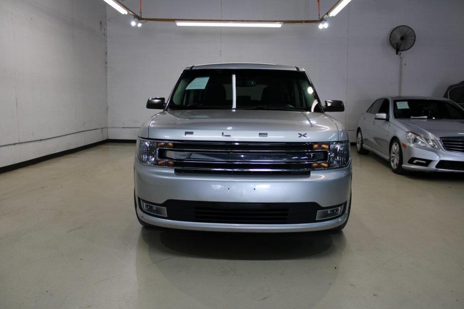 2013 Ingot Silver /Charcoal Black Ford Flex SEL (2FMGK5C83DB) with an 3.5L V6 Ti-VCT engine, Automatic transmission, located at 15300 Midway Rd., Addison, TX, 75001, (972) 702-0011, 32.958321, -96.838074 - HOME OF THE NO HAGGLE PRICE - WHOLESALE PRICES TO THE PUBLIC!! Flex SEL, 4D Sport Utility, 3.5L V6 Ti-VCT, 6-Speed Automatic with Select-Shift, FWD, Silver, Charcoal Black Cloth.<br><br>Silver 2013 Ford Flex SEL<br><br><br>Awards:<br> * 2013 IIHS Top Safety Pick * 2013 KBB.com Brand Image Awards< - Photo#5