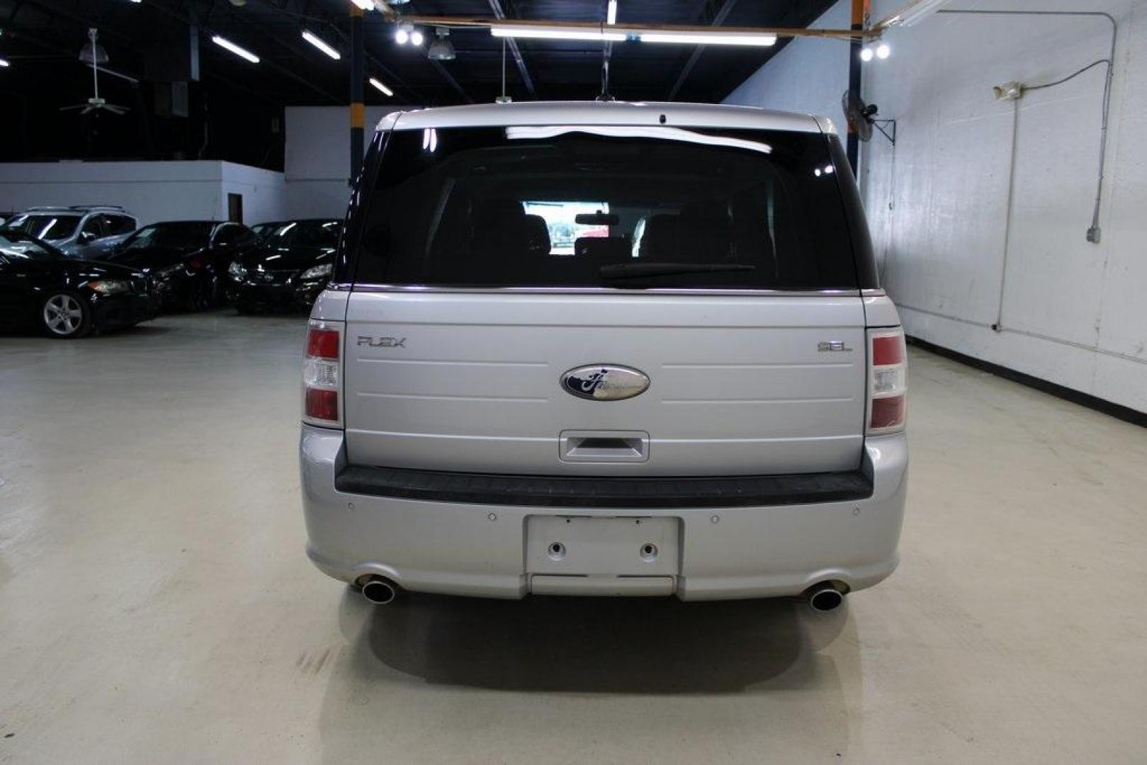 2013 Ingot Silver /Charcoal Black Ford Flex SEL (2FMGK5C83DB) with an 3.5L V6 Ti-VCT engine, Automatic transmission, located at 15300 Midway Rd., Addison, TX, 75001, (972) 702-0011, 32.958321, -96.838074 - HOME OF THE NO HAGGLE PRICE - WHOLESALE PRICES TO THE PUBLIC!! Flex SEL, 4D Sport Utility, 3.5L V6 Ti-VCT, 6-Speed Automatic with Select-Shift, FWD, Silver, Charcoal Black Cloth.<br><br>Silver 2013 Ford Flex SEL<br><br><br>Awards:<br> * 2013 IIHS Top Safety Pick * 2013 KBB.com Brand Image Awards< - Photo#7