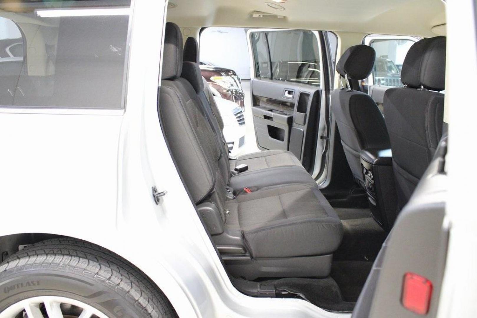 2013 Ingot Silver /Charcoal Black Ford Flex SEL (2FMGK5C83DB) with an 3.5L V6 Ti-VCT engine, Automatic transmission, located at 15300 Midway Rd., Addison, TX, 75001, (972) 702-0011, 32.958321, -96.838074 - HOME OF THE NO HAGGLE PRICE - WHOLESALE PRICES TO THE PUBLIC!! Flex SEL, 4D Sport Utility, 3.5L V6 Ti-VCT, 6-Speed Automatic with Select-Shift, FWD, Silver, Charcoal Black Cloth.<br><br>Silver 2013 Ford Flex SEL<br><br><br>Awards:<br> * 2013 IIHS Top Safety Pick * 2013 KBB.com Brand Image Awards< - Photo#13