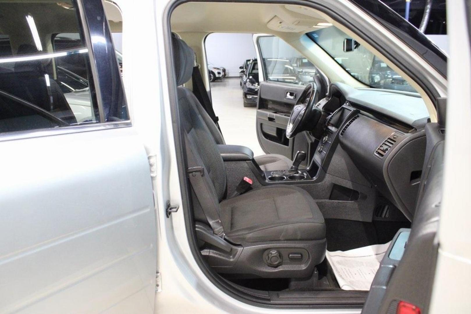 2013 Ingot Silver /Charcoal Black Ford Flex SEL (2FMGK5C83DB) with an 3.5L V6 Ti-VCT engine, Automatic transmission, located at 15300 Midway Rd., Addison, TX, 75001, (972) 702-0011, 32.958321, -96.838074 - HOME OF THE NO HAGGLE PRICE - WHOLESALE PRICES TO THE PUBLIC!! Flex SEL, 4D Sport Utility, 3.5L V6 Ti-VCT, 6-Speed Automatic with Select-Shift, FWD, Silver, Charcoal Black Cloth.<br><br>Silver 2013 Ford Flex SEL<br><br><br>Awards:<br> * 2013 IIHS Top Safety Pick * 2013 KBB.com Brand Image Awards< - Photo#14