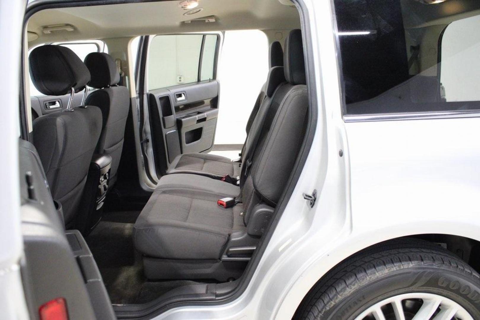 2013 Ingot Silver /Charcoal Black Ford Flex SEL (2FMGK5C83DB) with an 3.5L V6 Ti-VCT engine, Automatic transmission, located at 15300 Midway Rd., Addison, TX, 75001, (972) 702-0011, 32.958321, -96.838074 - HOME OF THE NO HAGGLE PRICE - WHOLESALE PRICES TO THE PUBLIC!! Flex SEL, 4D Sport Utility, 3.5L V6 Ti-VCT, 6-Speed Automatic with Select-Shift, FWD, Silver, Charcoal Black Cloth.<br><br>Silver 2013 Ford Flex SEL<br><br><br>Awards:<br> * 2013 IIHS Top Safety Pick * 2013 KBB.com Brand Image Awards< - Photo#15