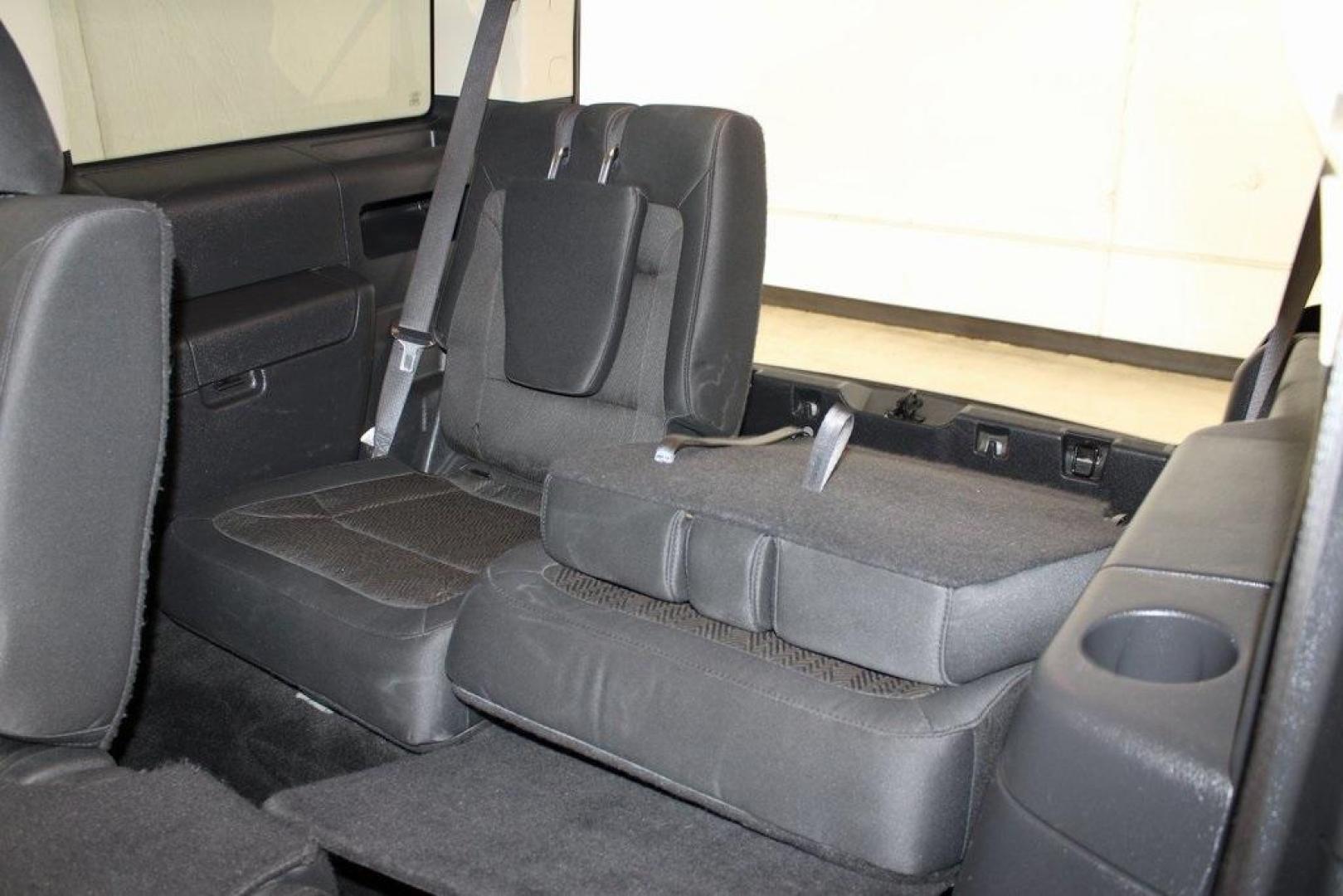 2013 Ingot Silver /Charcoal Black Ford Flex SEL (2FMGK5C83DB) with an 3.5L V6 Ti-VCT engine, Automatic transmission, located at 15300 Midway Rd., Addison, TX, 75001, (972) 702-0011, 32.958321, -96.838074 - HOME OF THE NO HAGGLE PRICE - WHOLESALE PRICES TO THE PUBLIC!! Flex SEL, 4D Sport Utility, 3.5L V6 Ti-VCT, 6-Speed Automatic with Select-Shift, FWD, Silver, Charcoal Black Cloth.<br><br>Silver 2013 Ford Flex SEL<br><br><br>Awards:<br> * 2013 IIHS Top Safety Pick * 2013 KBB.com Brand Image Awards< - Photo#16