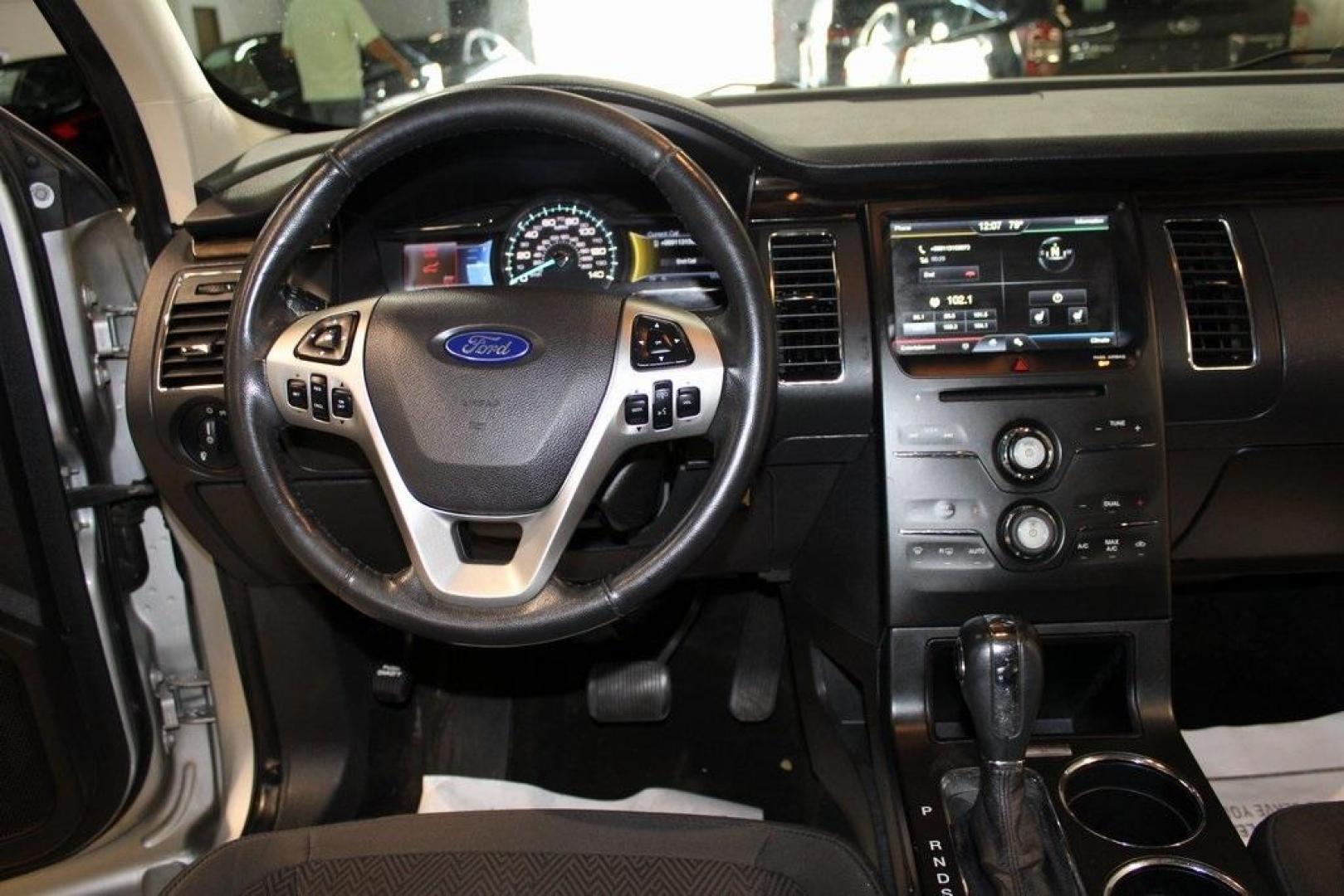 2013 Ingot Silver /Charcoal Black Ford Flex SEL (2FMGK5C83DB) with an 3.5L V6 Ti-VCT engine, Automatic transmission, located at 15300 Midway Rd., Addison, TX, 75001, (972) 702-0011, 32.958321, -96.838074 - HOME OF THE NO HAGGLE PRICE - WHOLESALE PRICES TO THE PUBLIC!! Flex SEL, 4D Sport Utility, 3.5L V6 Ti-VCT, 6-Speed Automatic with Select-Shift, FWD, Silver, Charcoal Black Cloth.<br><br>Silver 2013 Ford Flex SEL<br><br><br>Awards:<br> * 2013 IIHS Top Safety Pick * 2013 KBB.com Brand Image Awards< - Photo#19