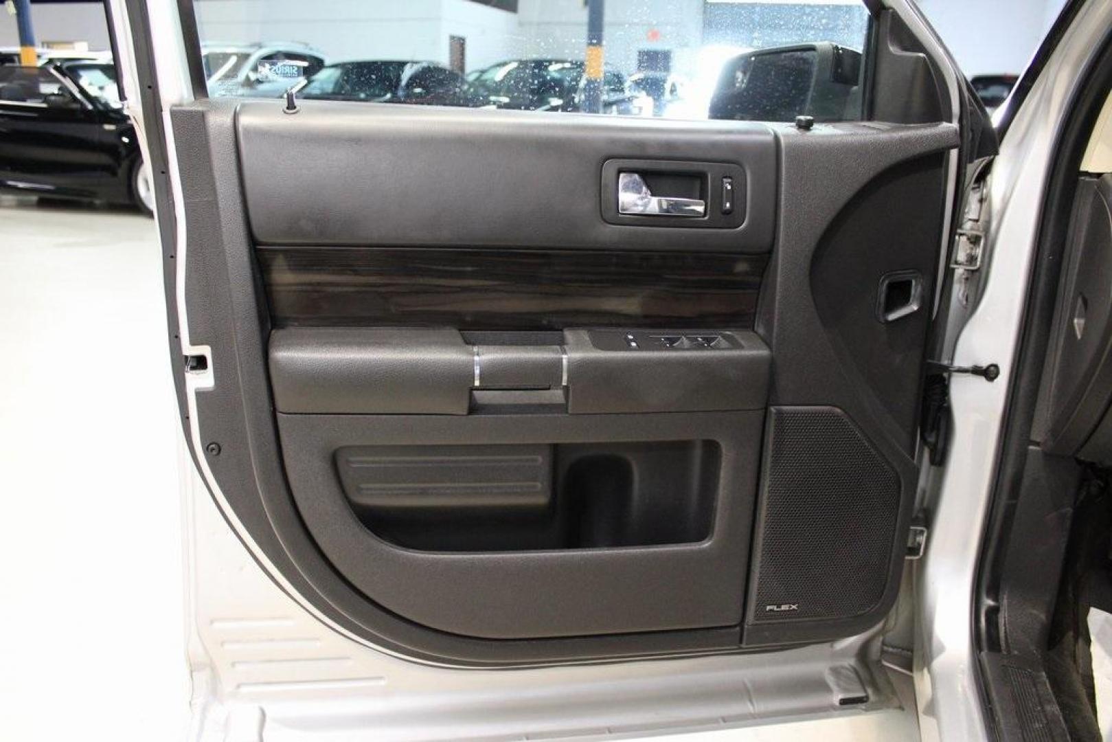 2013 Ingot Silver /Charcoal Black Ford Flex SEL (2FMGK5C83DB) with an 3.5L V6 Ti-VCT engine, Automatic transmission, located at 15300 Midway Rd., Addison, TX, 75001, (972) 702-0011, 32.958321, -96.838074 - HOME OF THE NO HAGGLE PRICE - WHOLESALE PRICES TO THE PUBLIC!! Flex SEL, 4D Sport Utility, 3.5L V6 Ti-VCT, 6-Speed Automatic with Select-Shift, FWD, Silver, Charcoal Black Cloth.<br><br>Silver 2013 Ford Flex SEL<br><br><br>Awards:<br> * 2013 IIHS Top Safety Pick * 2013 KBB.com Brand Image Awards< - Photo#24