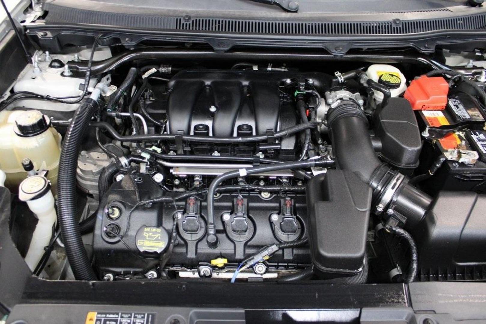 2013 Ingot Silver /Charcoal Black Ford Flex SEL (2FMGK5C83DB) with an 3.5L V6 Ti-VCT engine, Automatic transmission, located at 15300 Midway Rd., Addison, TX, 75001, (972) 702-0011, 32.958321, -96.838074 - HOME OF THE NO HAGGLE PRICE - WHOLESALE PRICES TO THE PUBLIC!! Flex SEL, 4D Sport Utility, 3.5L V6 Ti-VCT, 6-Speed Automatic with Select-Shift, FWD, Silver, Charcoal Black Cloth.<br><br>Silver 2013 Ford Flex SEL<br><br><br>Awards:<br> * 2013 IIHS Top Safety Pick * 2013 KBB.com Brand Image Awards< - Photo#26