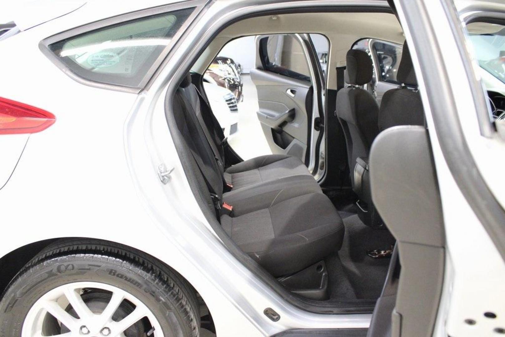2018 Ingot Silver /Charcoal Black Ford Focus SE (1FADP3K24JL) with an 2.0L I4 DGI Ti-VCT engine, Automatic transmission, located at 15300 Midway Rd., Addison, TX, 75001, (972) 702-0011, 32.958321, -96.838074 - Photo#14
