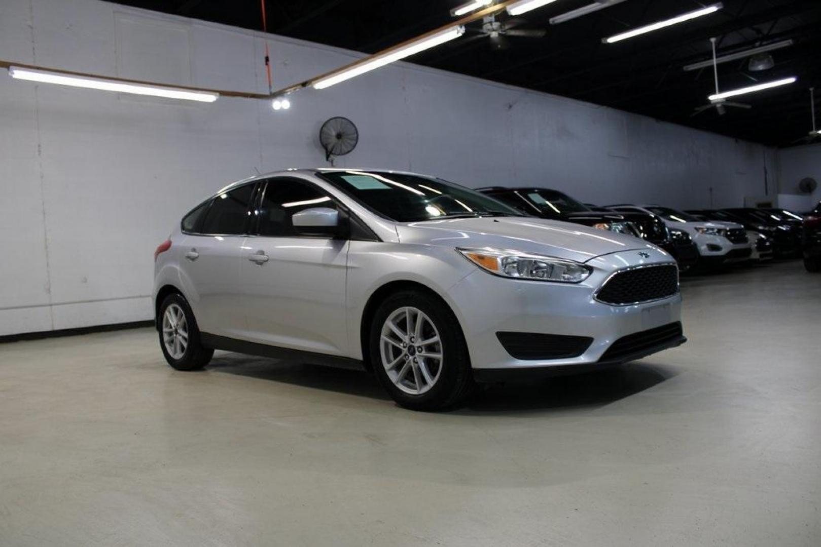 2018 Ingot Silver /Charcoal Black Ford Focus SE (1FADP3K24JL) with an 2.0L I4 DGI Ti-VCT engine, Automatic transmission, located at 15300 Midway Rd., Addison, TX, 75001, (972) 702-0011, 32.958321, -96.838074 - Photo#6