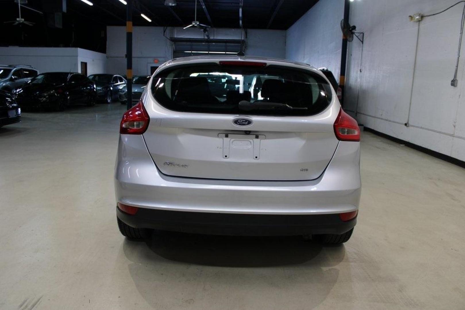 2018 Ingot Silver /Charcoal Black Ford Focus SE (1FADP3K24JL) with an 2.0L I4 DGI Ti-VCT engine, Automatic transmission, located at 15300 Midway Rd., Addison, TX, 75001, (972) 702-0011, 32.958321, -96.838074 - Photo#7