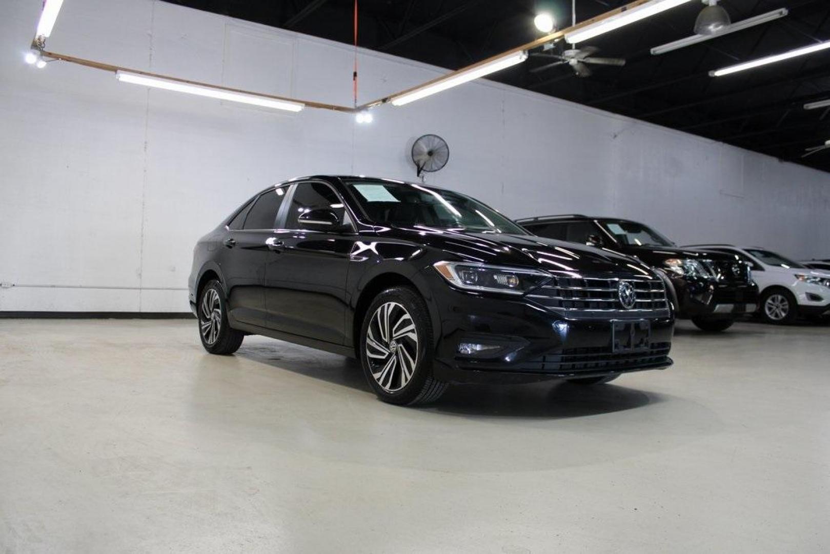 2020 Deep Black Pearl Metallic /Dark Beige/Black Volkswagen Jetta SEL Premium (3VWG57BU8LM) with an 1.4L TSI engine, Automatic transmission, located at 15300 Midway Rd., Addison, TX, 75001, (972) 702-0011, 32.958321, -96.838074 - HOME OF THE NO HAGGLE PRICE - WHOLESALE PRICES TO THE PUBLIC!! Navigation, Backup Camera, Leather Seats, Sunroof / Moonroof, non smoker, Jetta SEL, 4D Sedan, 1.4L TSI, 8-Speed Automatic, FWD, Black, Dark Beige/Black Leather.<br><br>Black 2020 Volkswagen Jetta SEL Premium<br><br>Recent Arrival! 30/40 - Photo#1