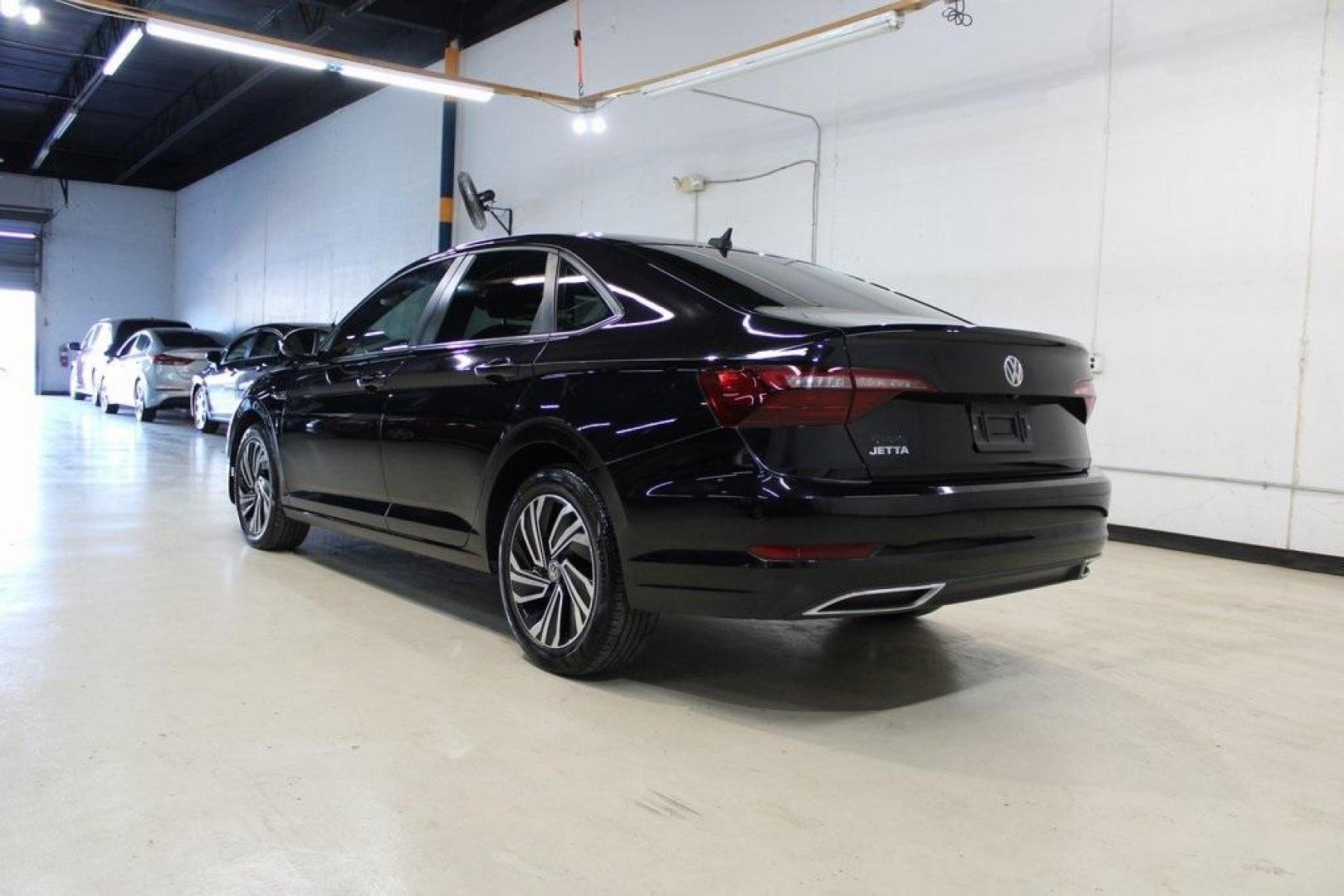 2020 Deep Black Pearl Metallic /Dark Beige/Black Volkswagen Jetta SEL Premium (3VWG57BU8LM) with an 1.4L TSI engine, Automatic transmission, located at 15300 Midway Rd., Addison, TX, 75001, (972) 702-0011, 32.958321, -96.838074 - HOME OF THE NO HAGGLE PRICE - WHOLESALE PRICES TO THE PUBLIC!! Navigation, Backup Camera, Leather Seats, Sunroof / Moonroof, non smoker, Jetta SEL, 4D Sedan, 1.4L TSI, 8-Speed Automatic, FWD, Black, Dark Beige/Black Leather.<br><br>Black 2020 Volkswagen Jetta SEL Premium<br><br>Recent Arrival! 30/40 - Photo#4