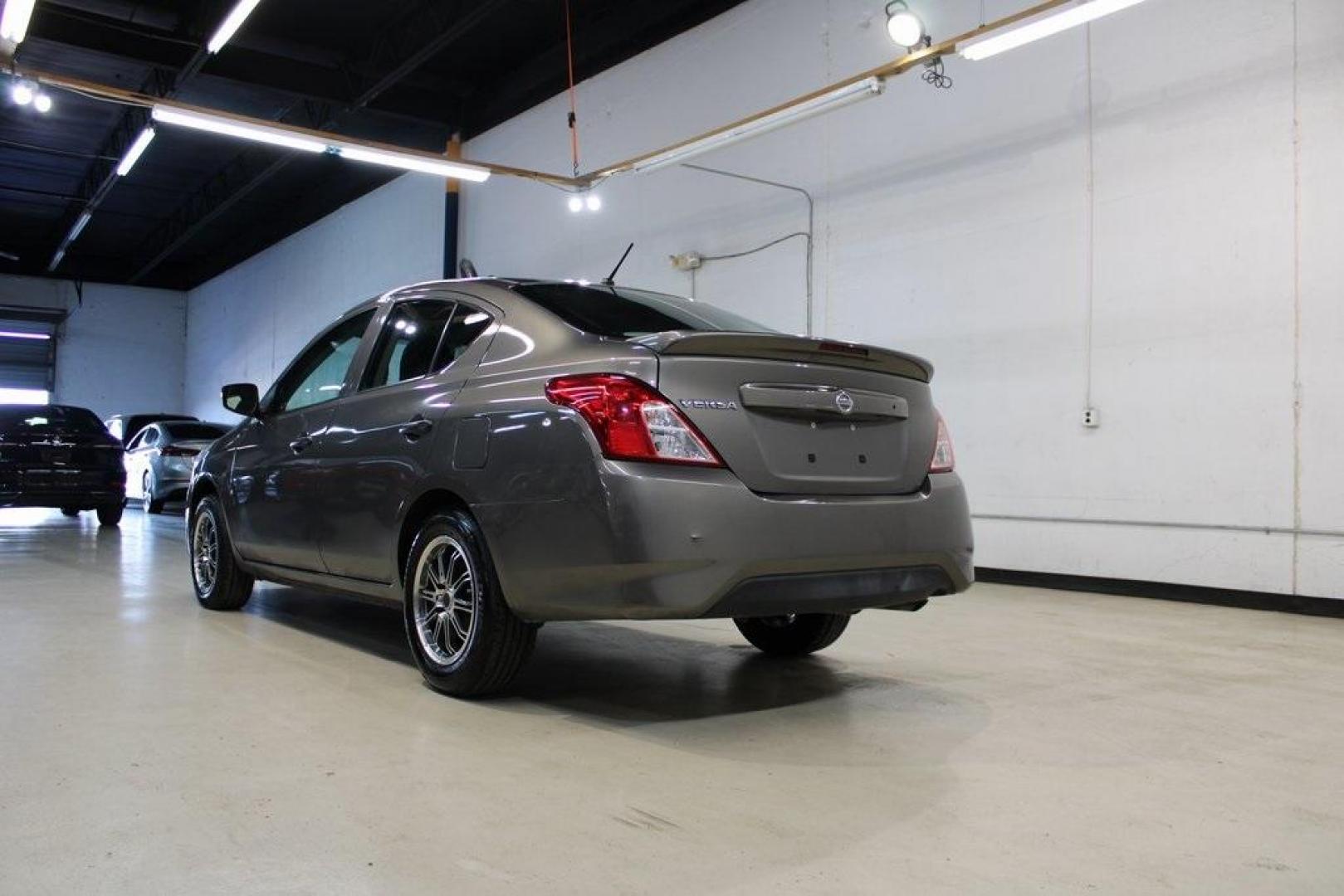 2017 Titanium /Charcoal Nissan Versa 1.6 S Plus (3N1CN7AP9HL) with an 1.6L I4 DOHC 16V engine, CVT transmission, located at 15300 Midway Rd., Addison, TX, 75001, (972) 702-0011, 32.958321, -96.838074 - Introducing the 2017 Nissan Versa 1.6 SV, now available at Midway Auto Group in Addison, Texas. This compact sedan offers a blend of efficiency, comfort, and modern features, making it an excellent choice for daily commutes and city driving.<br>BidFax<br><br>Key Features:<br><br>Engine: 1.6L I4 DOHC - Photo#4