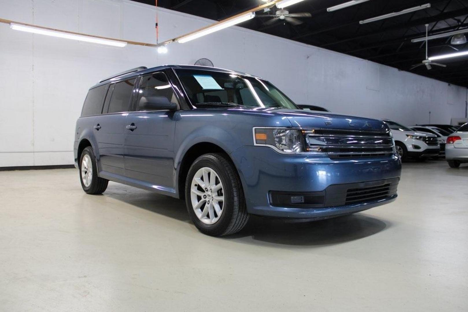 2018 Blue /Charcoal Black Ford Flex SE (2FMGK5B87JB) with an 3.5L V6 Ti-VCT engine, Automatic transmission, located at 15300 Midway Rd., Addison, TX, 75001, (972) 702-0011, 32.958321, -96.838074 - Introducing the 2018 Ford Flex SE, now available at Midway Auto Group in Addison, Texas. This spacious and versatile SUV offers a comfortable ride with ample room for passengers and cargo, making it an excellent choice for families and travelers alike.<br><br>Key Features:<br><br>Engine: 3.5L V6 Ti- - Photo#1