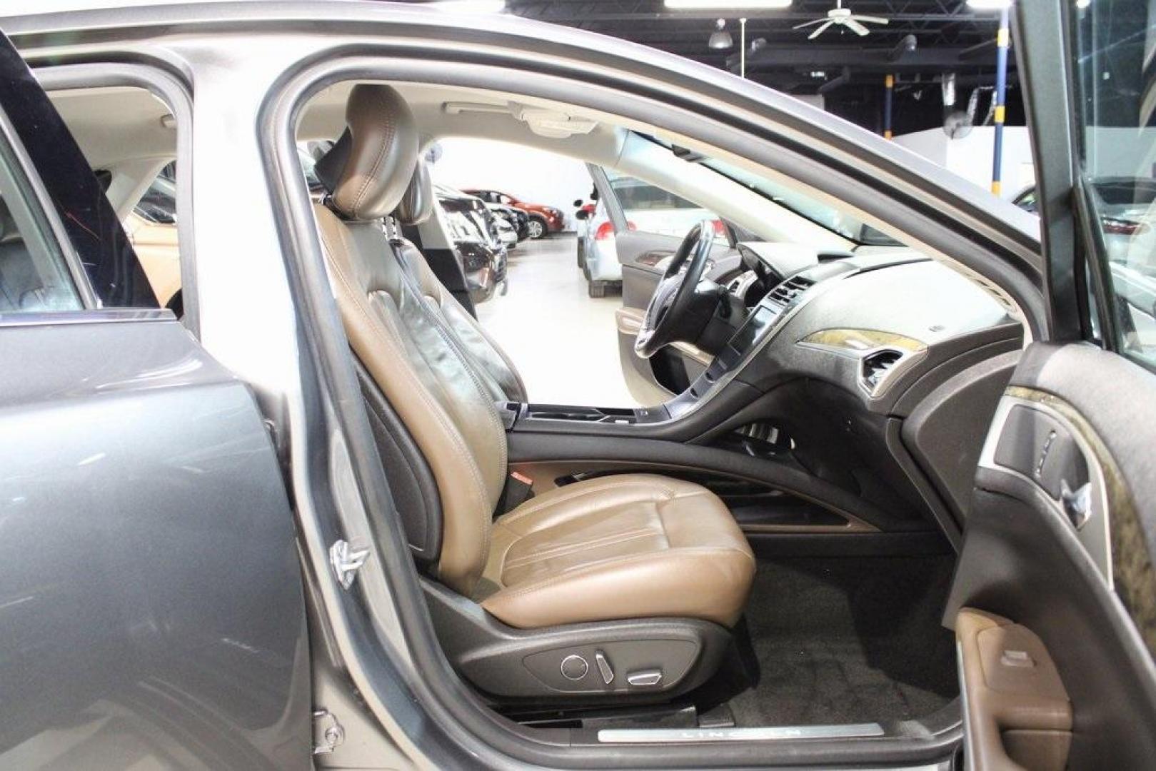 2014 Sterling Gray Metallic /Hazelnut Lincoln MKZ Hybrid (3LN6L2LUXER) with an 2.0L I4 Atkinson-Cycle iVCT engine, CVT transmission, located at 15300 Midway Rd., Addison, TX, 75001, (972) 702-0011, 32.958321, -96.838074 - Photo#10