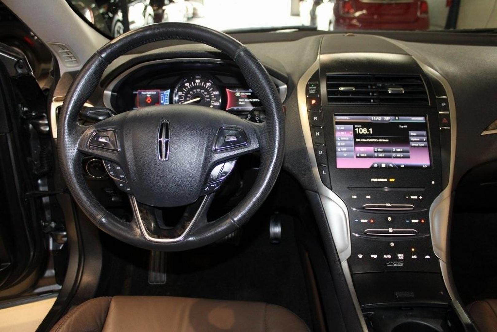 2014 Sterling Gray Metallic /Hazelnut Lincoln MKZ Hybrid (3LN6L2LUXER) with an 2.0L I4 Atkinson-Cycle iVCT engine, CVT transmission, located at 15300 Midway Rd., Addison, TX, 75001, (972) 702-0011, 32.958321, -96.838074 - Photo#13