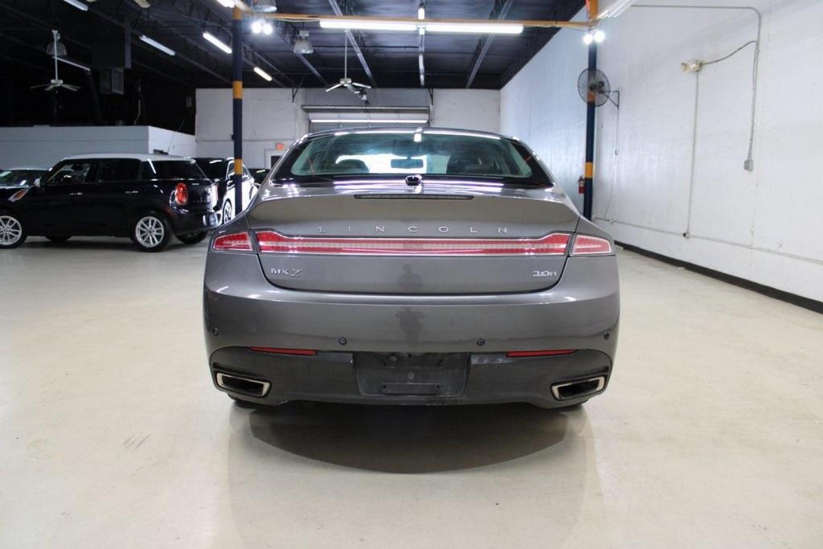 2014 Sterling Gray Metallic /Hazelnut Lincoln MKZ Hybrid (3LN6L2LUXER) with an 2.0L I4 Atkinson-Cycle iVCT engine, CVT transmission, located at 15300 Midway Rd., Addison, TX, 75001, (972) 702-0011, 32.958321, -96.838074 - Photo#1