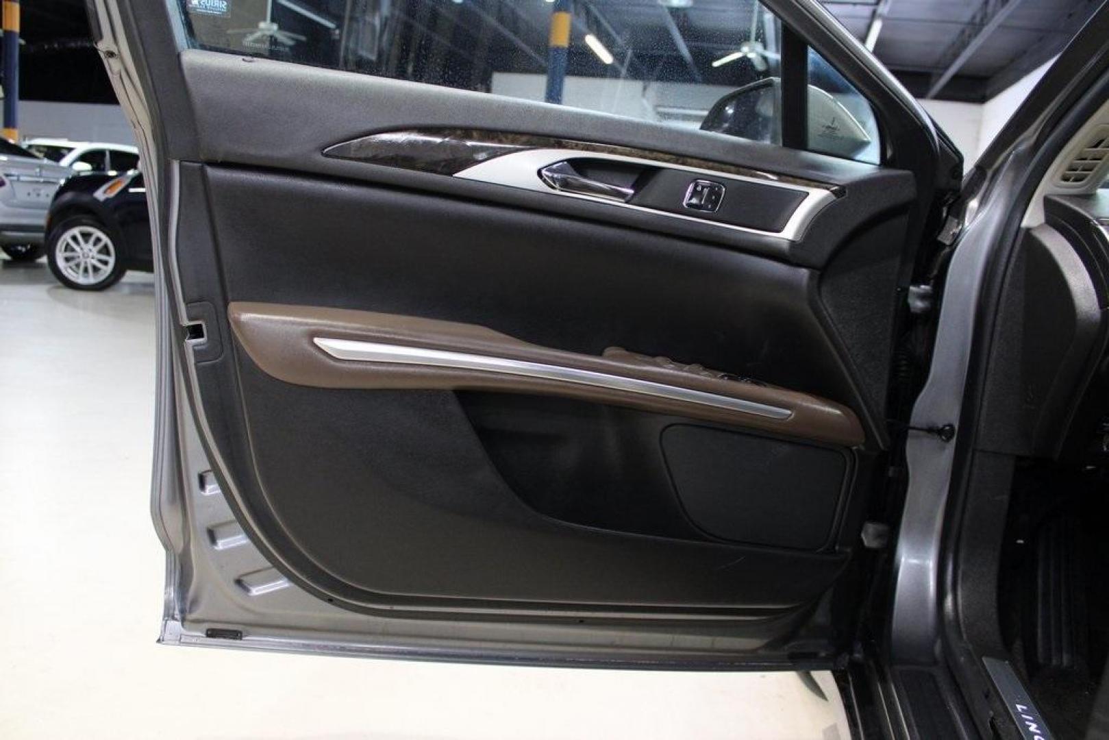 2014 Sterling Gray Metallic /Hazelnut Lincoln MKZ Hybrid (3LN6L2LUXER) with an 2.0L I4 Atkinson-Cycle iVCT engine, CVT transmission, located at 15300 Midway Rd., Addison, TX, 75001, (972) 702-0011, 32.958321, -96.838074 - Photo#22