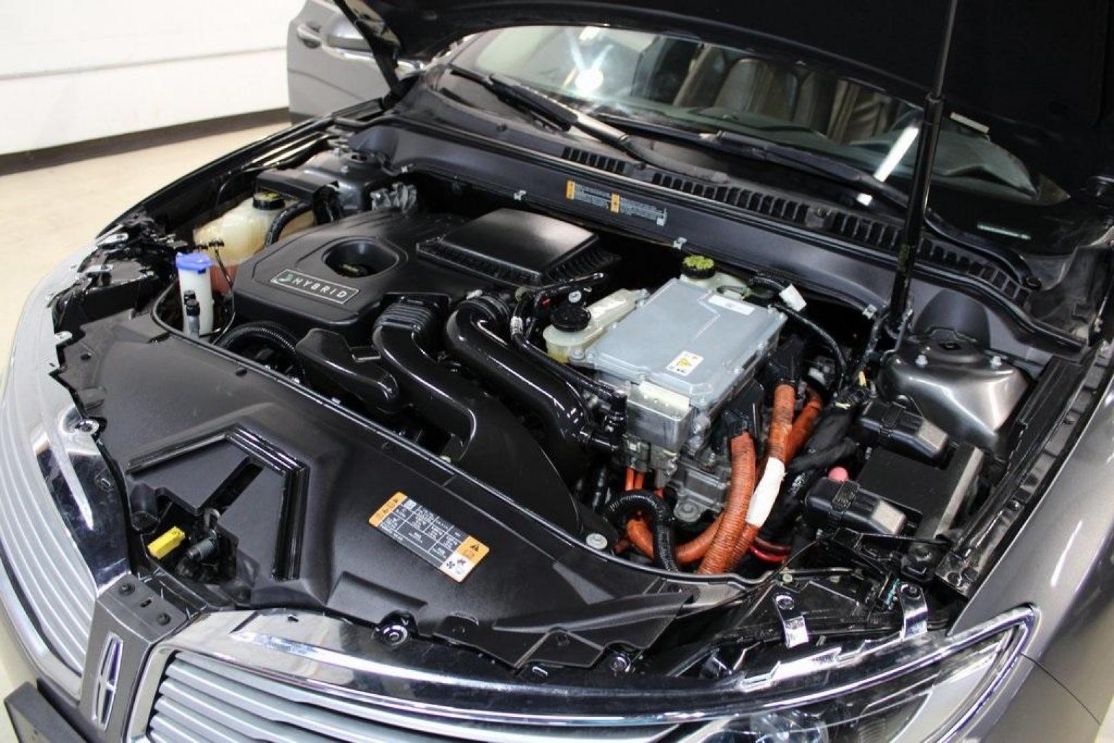 2014 Sterling Gray Metallic /Hazelnut Lincoln MKZ Hybrid (3LN6L2LUXER) with an 2.0L I4 Atkinson-Cycle iVCT engine, CVT transmission, located at 15300 Midway Rd., Addison, TX, 75001, (972) 702-0011, 32.958321, -96.838074 - Photo#25