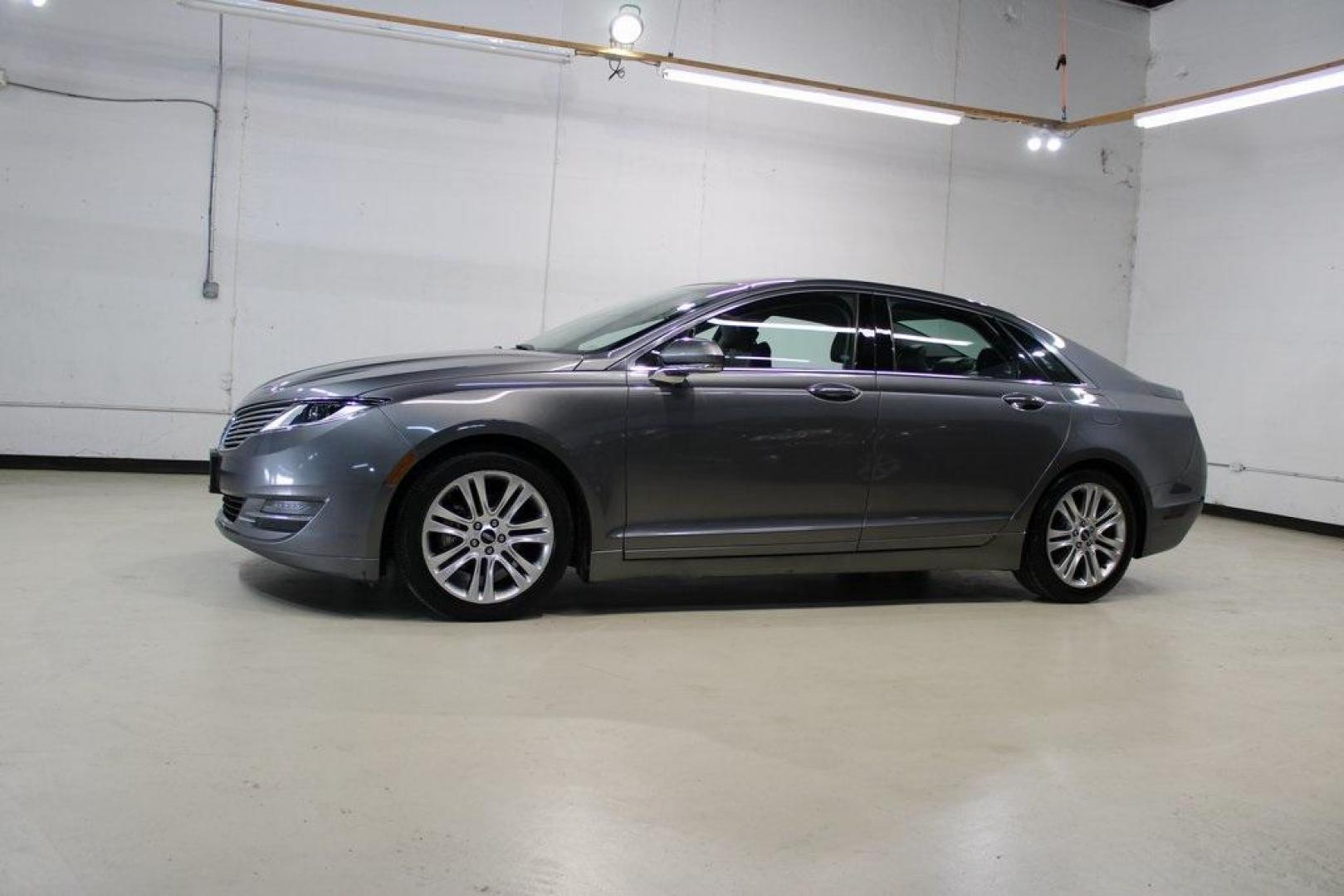 2014 Sterling Gray Metallic /Hazelnut Lincoln MKZ Hybrid (3LN6L2LUXER) with an 2.0L I4 Atkinson-Cycle iVCT engine, CVT transmission, located at 15300 Midway Rd., Addison, TX, 75001, (972) 702-0011, 32.958321, -96.838074 - Photo#2